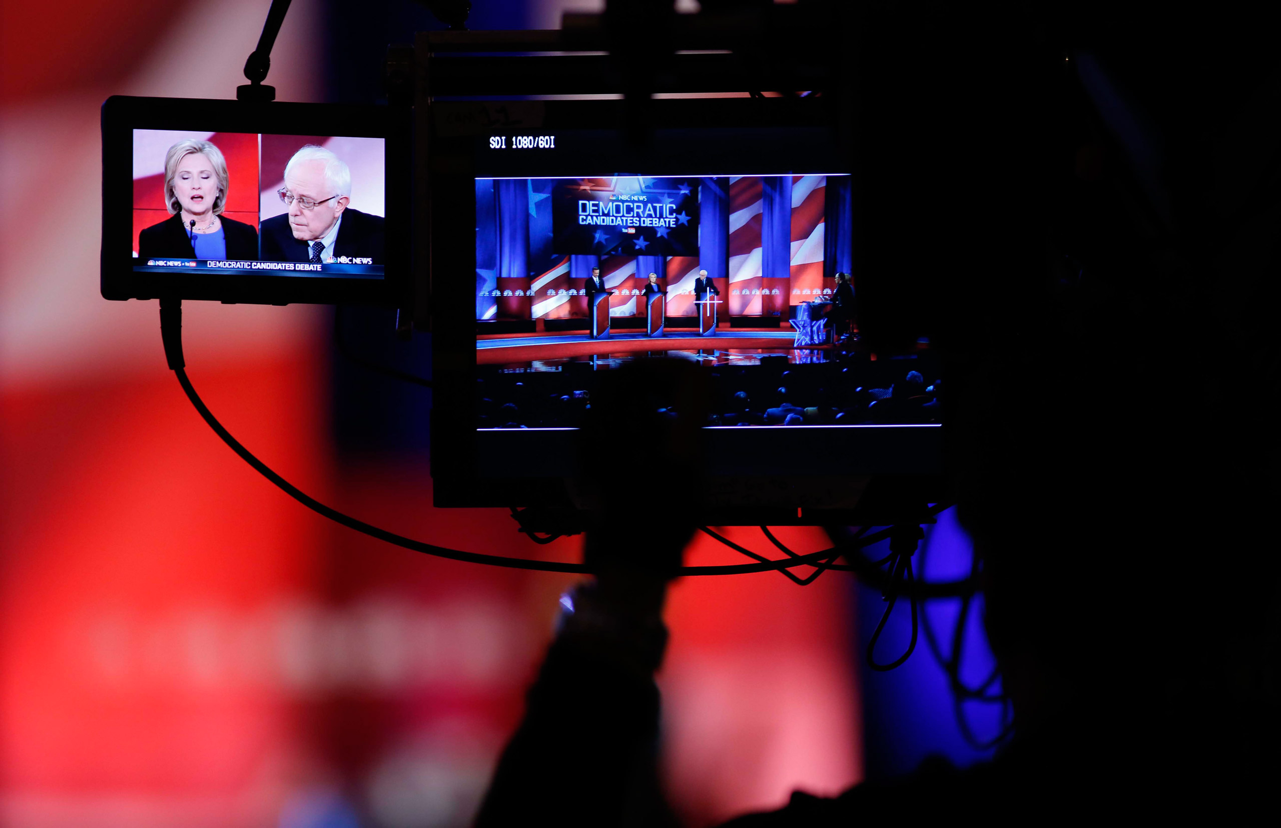 A camera man focuses on Democratic presidential candidates Hillary Clinton   and Sen. Bernie Sanders, I-Vt, as they participate in the NBC, YouTube Democratic presidential debate at the Gaillard Center, Sunday, Jan. 17, 2016, in Charleston, S.C. (AP Photo/Mic Smith)