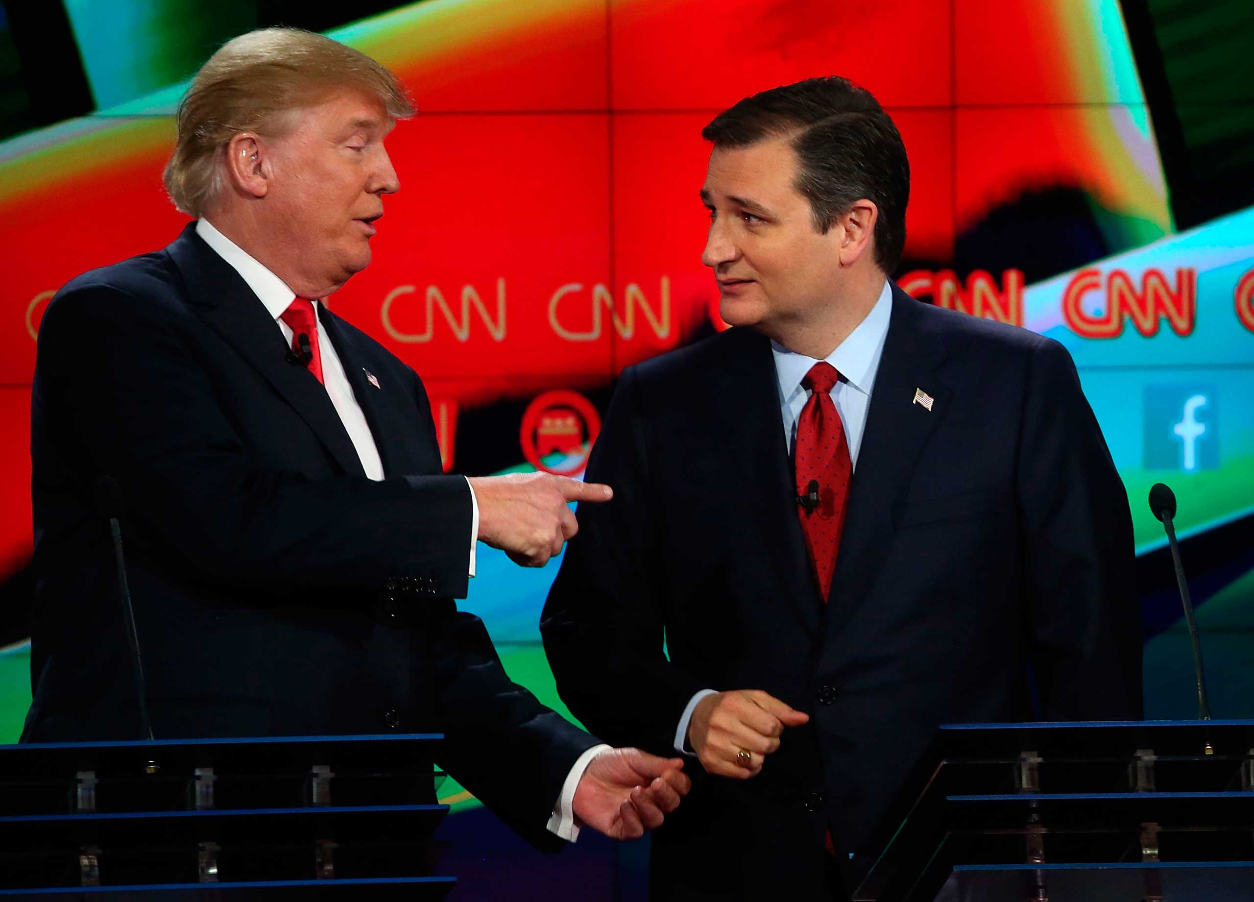 Republican presidential candidates Donald Trump and Sen. Ted Cruz (R-TX) interact at the conclusion of CNN's GOP presidential debate at The Venetian Las Vegas on Dec. 15, 2015. (Justin Sullivan—Getty Images)