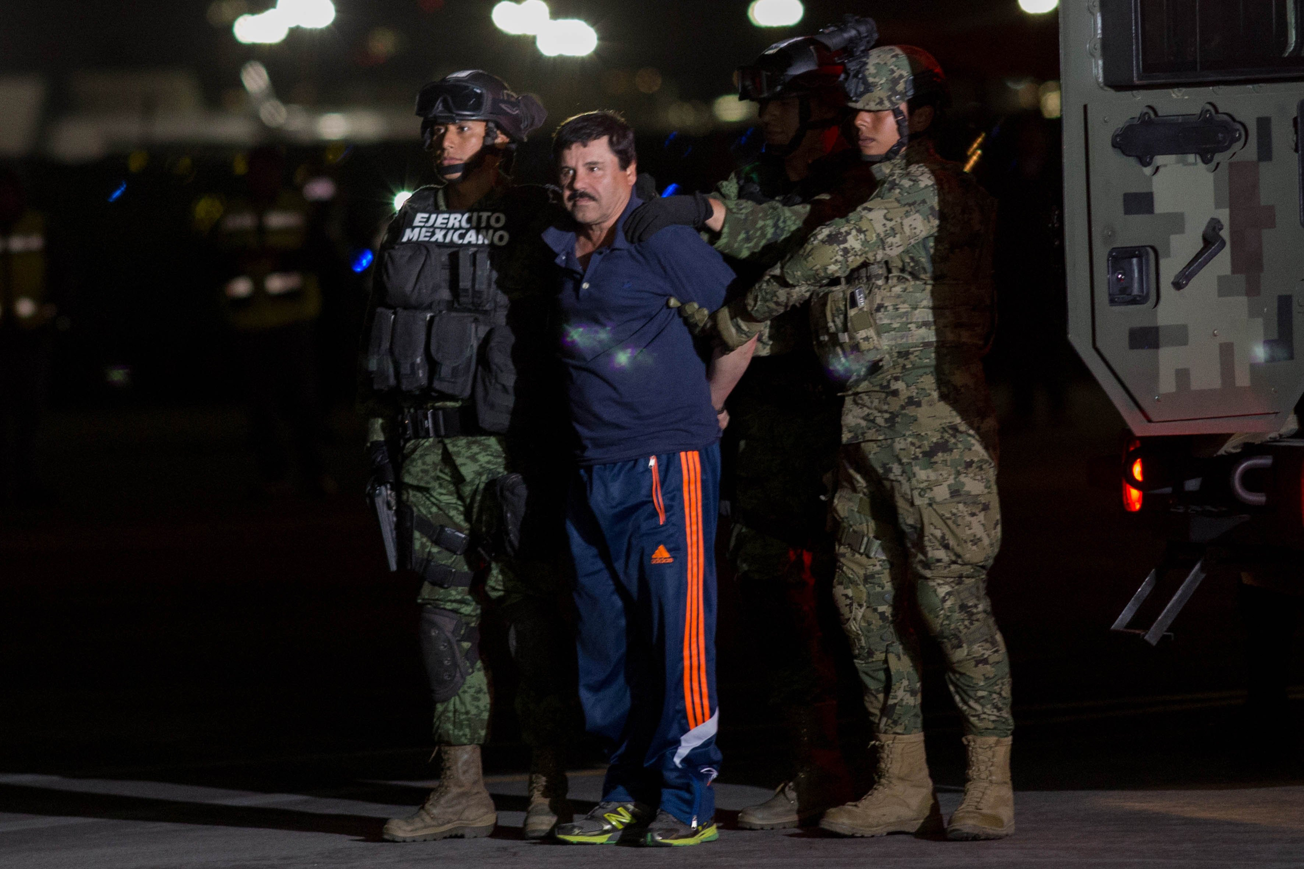 Mexican soldiers escort Joaquín Guzmán upon his arrival in Mexico City after his arrest on Jan. 8 (Xinhua/Polaris)