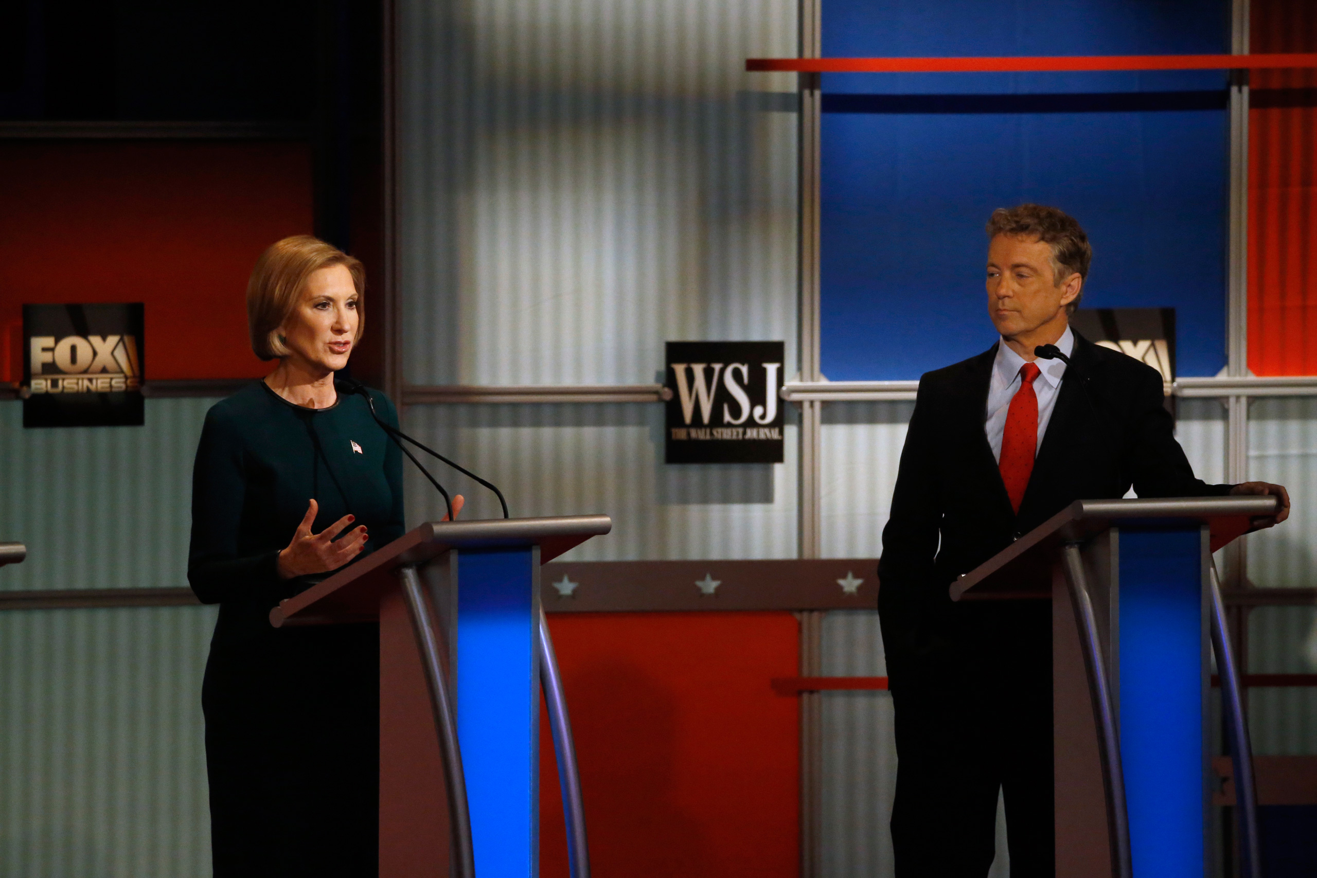 Carly Fiorina speaks as Rand Paul listens during the Republican presidential debate at the Milwaukee Theatre in Milwaukee on Nov. 11, 2015. (Morry Gash—AP)