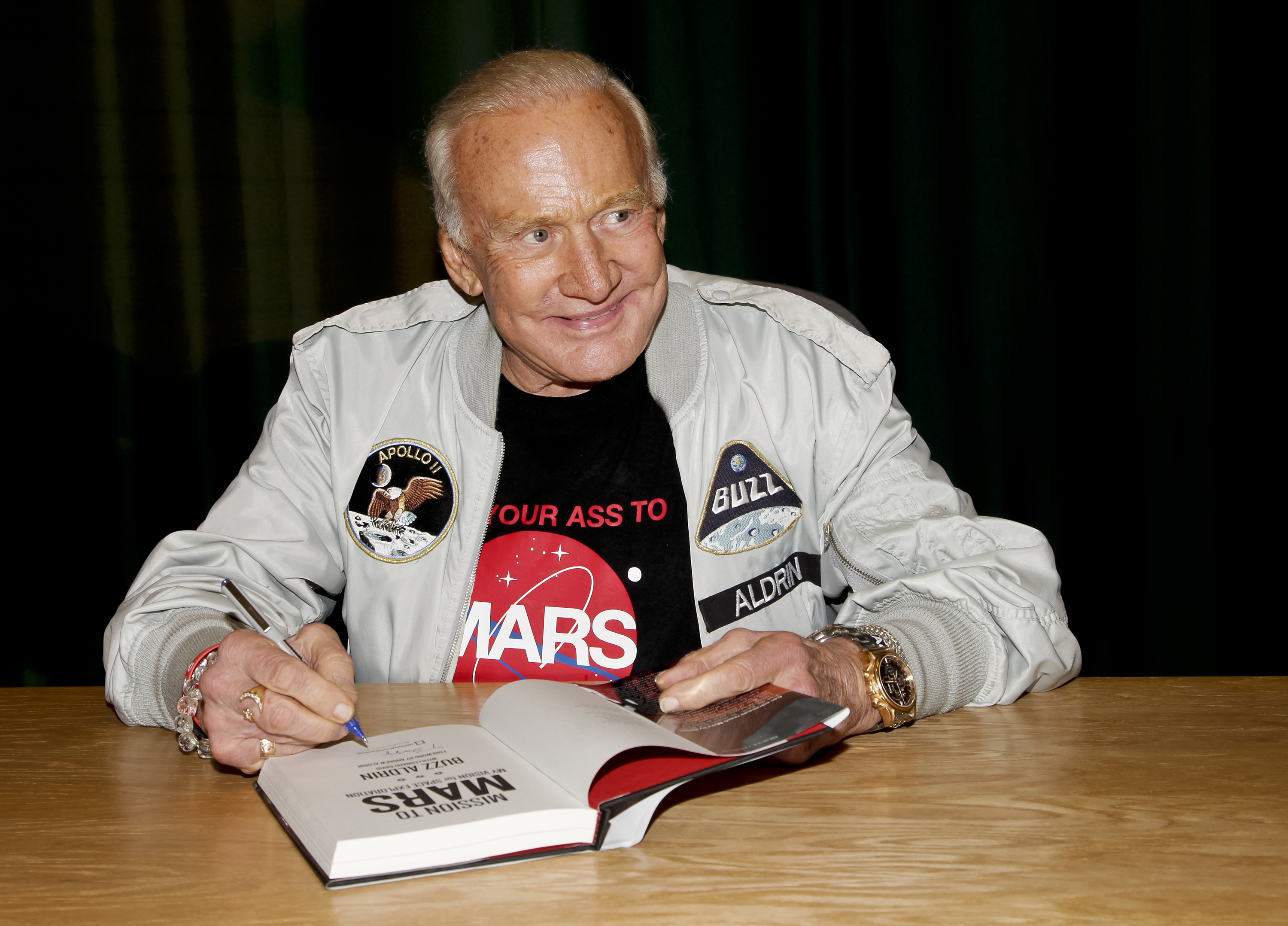 Buzz Aldrin signs copies of his book at at Barnes &amp; Noble Booksellers Glendale, Calif. on July 28, 2014. (Tibrina Hobson—FilmMagic/Getty Images)