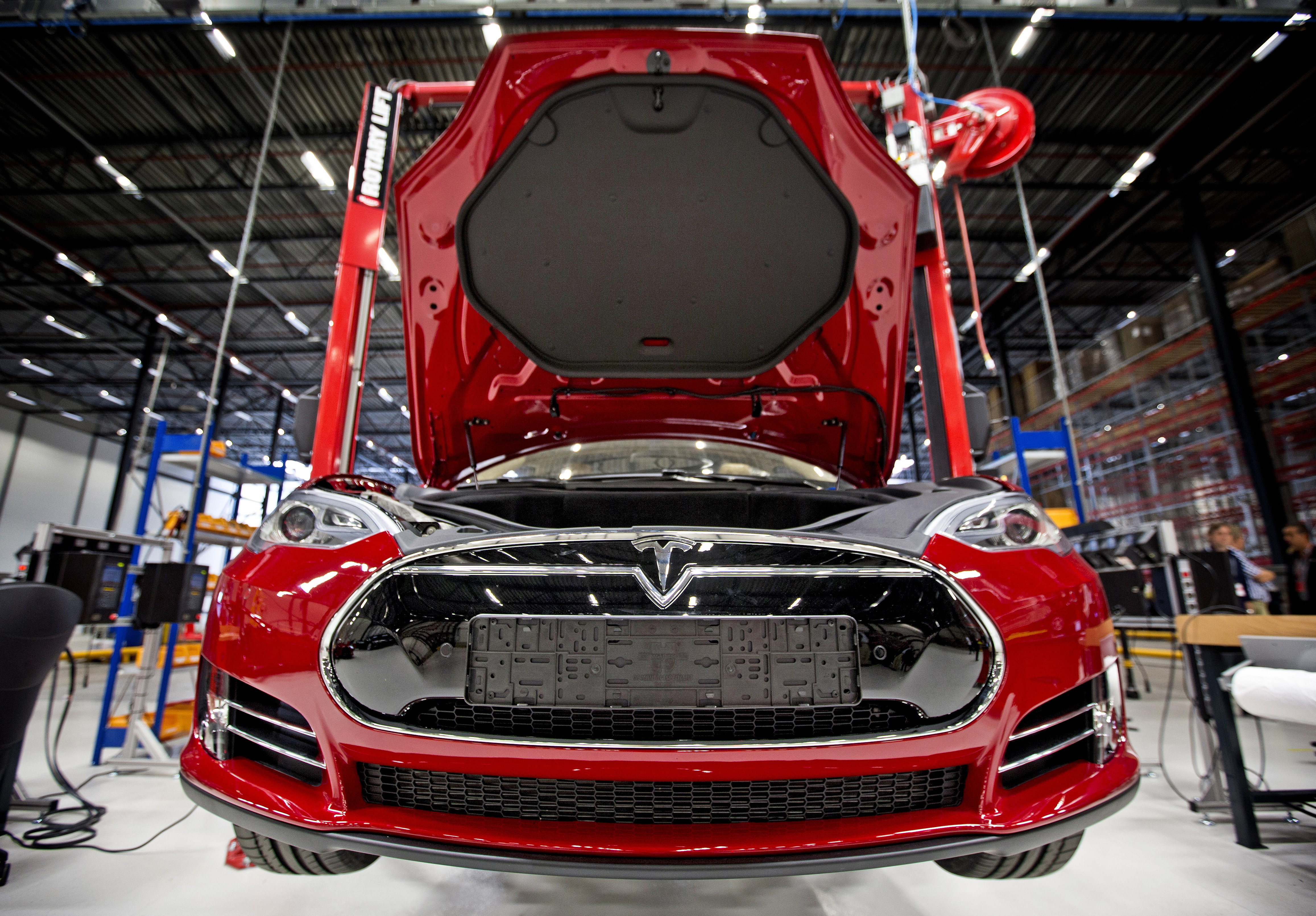 A view of a fully electric Tesla car on an assembly line at the new Tesla Motors car factory in Tilburg, the Netherlands, during the opening and launch of the new factory, on August 22, 2013. (AFP&mdash;AFP/Getty Images)