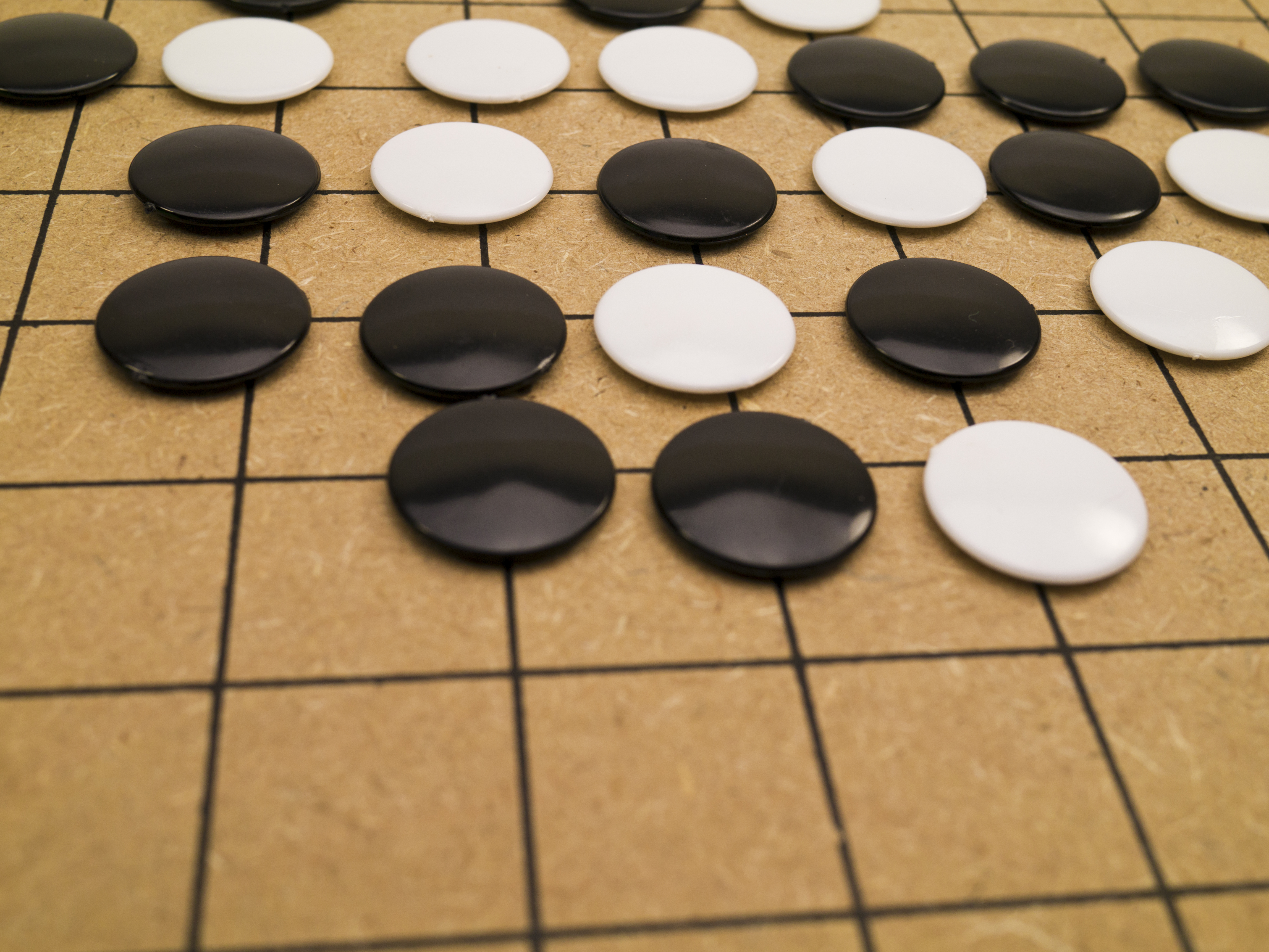 Stones on a Go board (photoncatcher&mdash;Getty Images/iStockphoto)