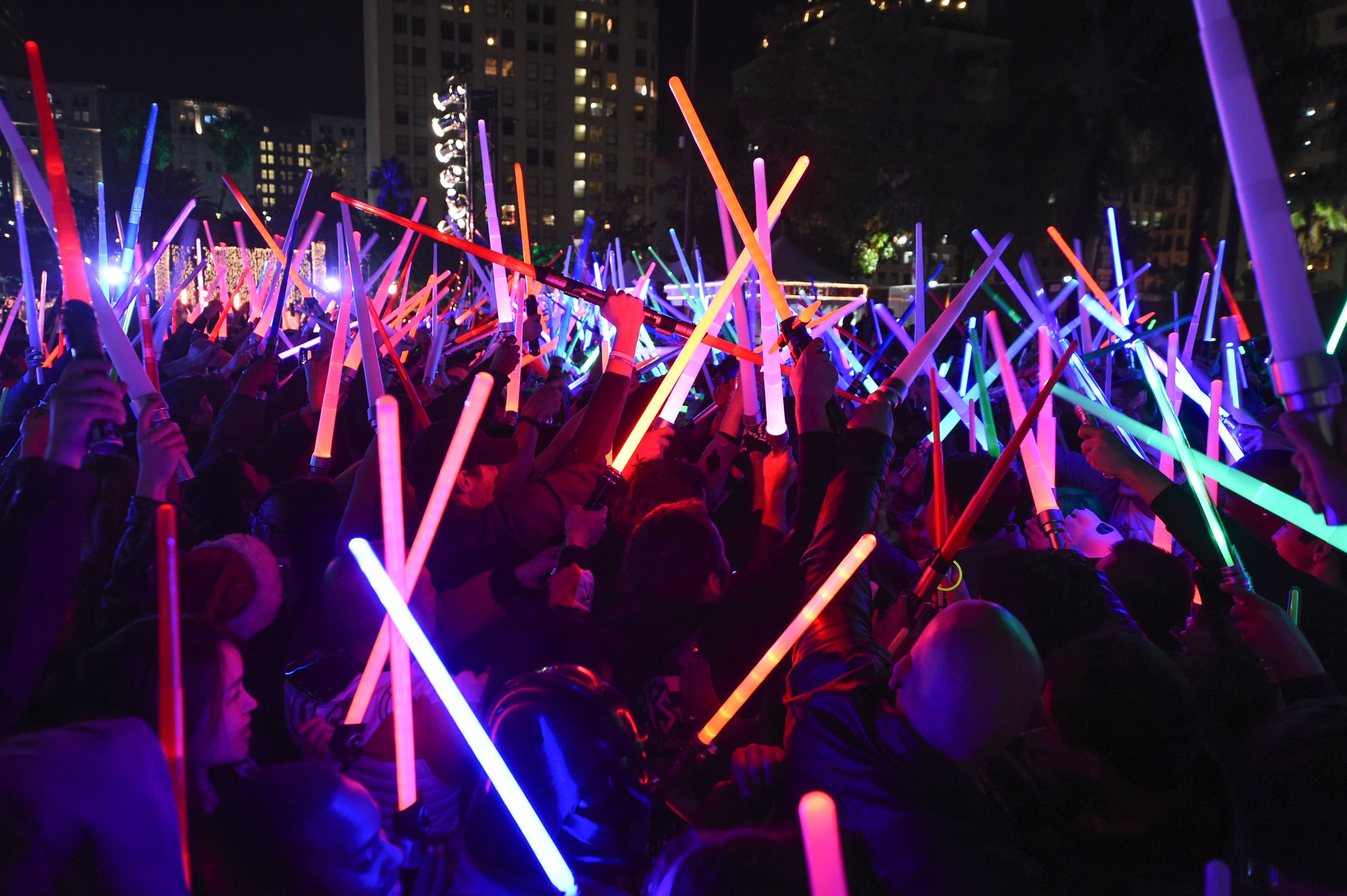 'Star Wars' fans raise their lightsabers in Pershing Square in downtown Los Angeles, Calif., on Dec. 18, 2015. (Robyn Beck—AFP/Getty Images)