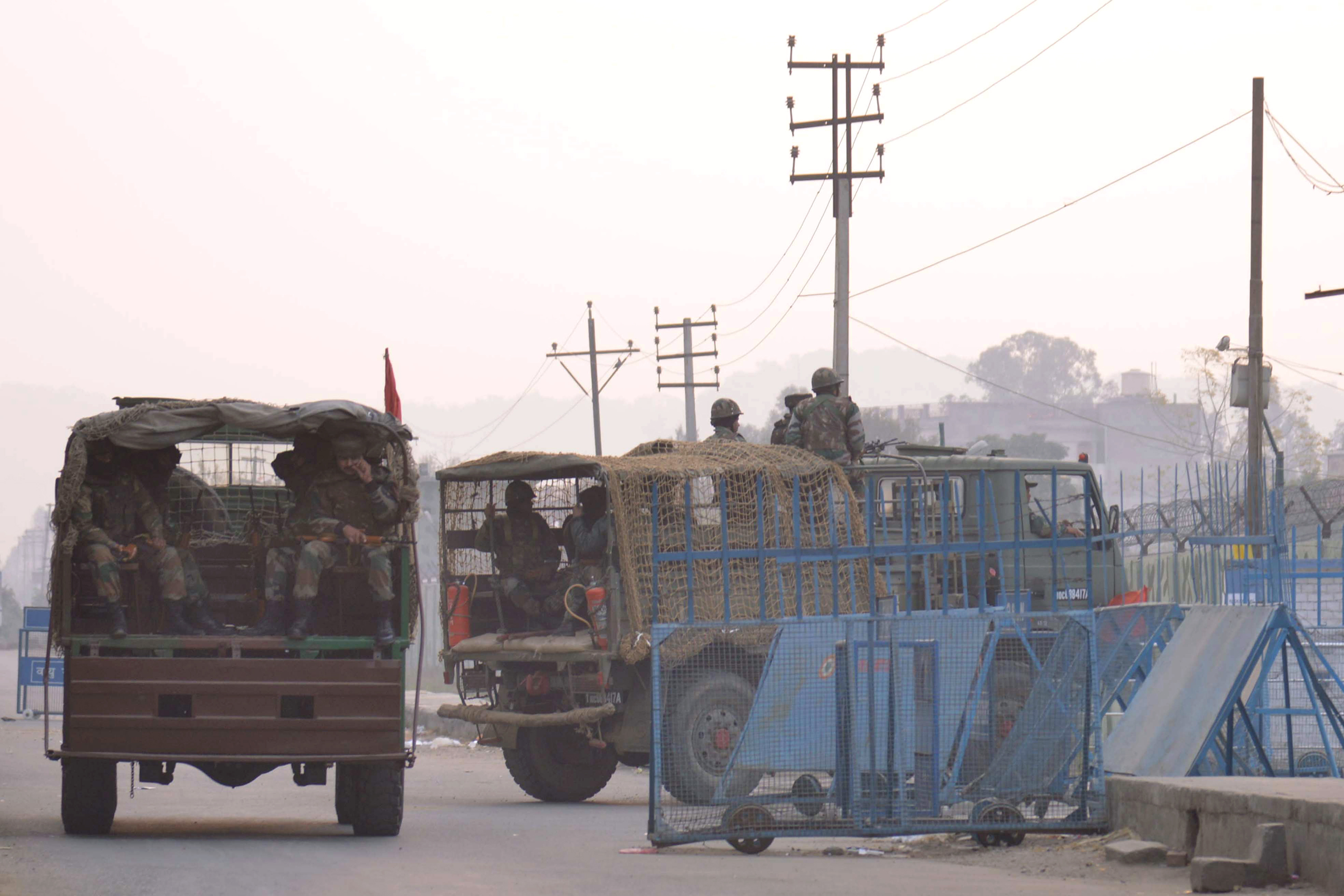 Indian army trucks transport troops to the air-force base in Pathankot on Jan. 4, 2016, after a weekend of fierce fighting with suspected Islamic insurgents, in which seven soldiers and five attackers were killed (Narinder Nanu—AFP/Getty Images)