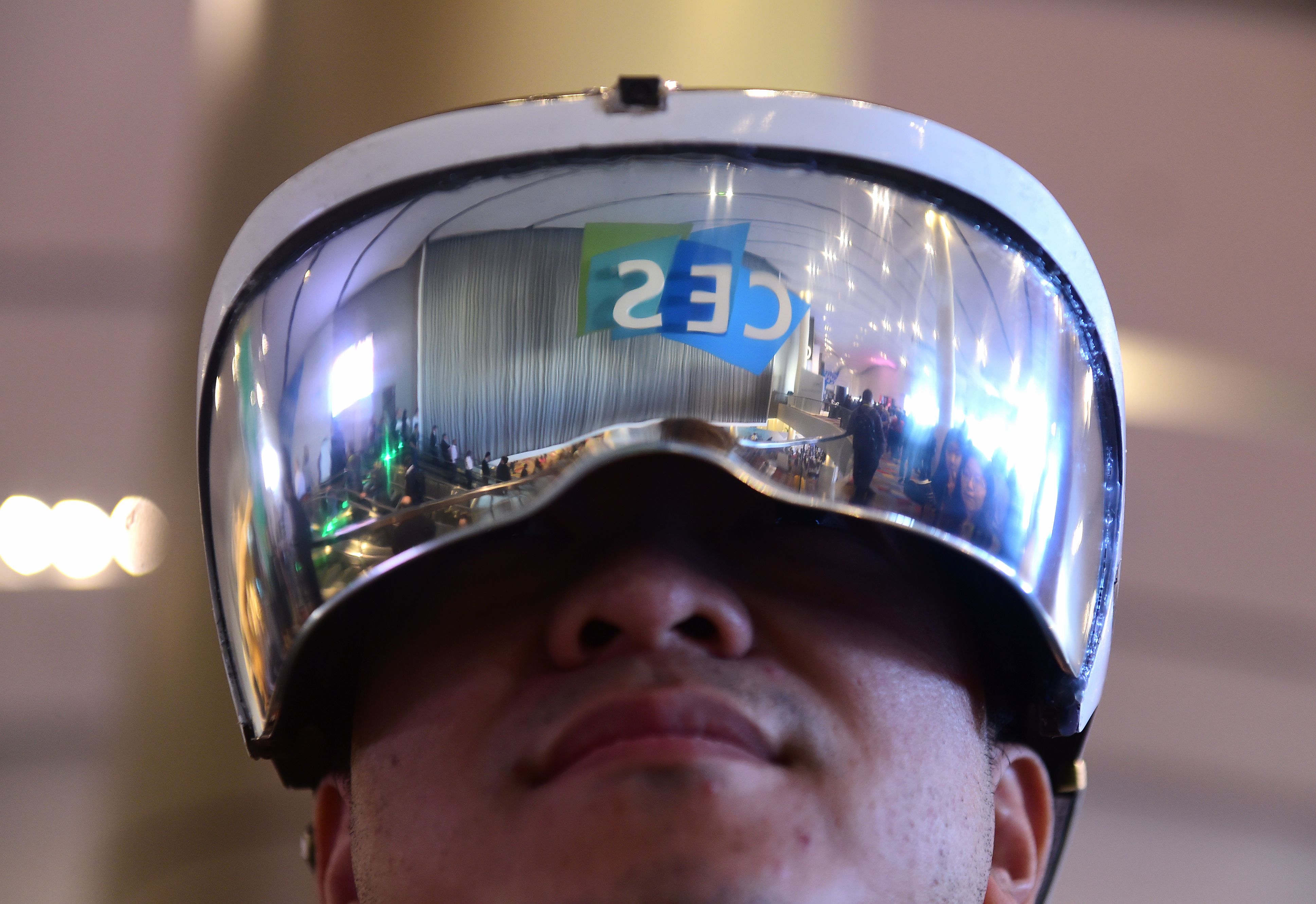 Attendee Wei Rongjie wears a working prototype of his HoloSeer AR/VR all-in-one agumented reality and virtual reality headseat, January 6, 2016 at the CES 2016 Consumer Electronics Show in Las Vegas, Nevada. (Robyn BeckK—AFP/Getty Images)