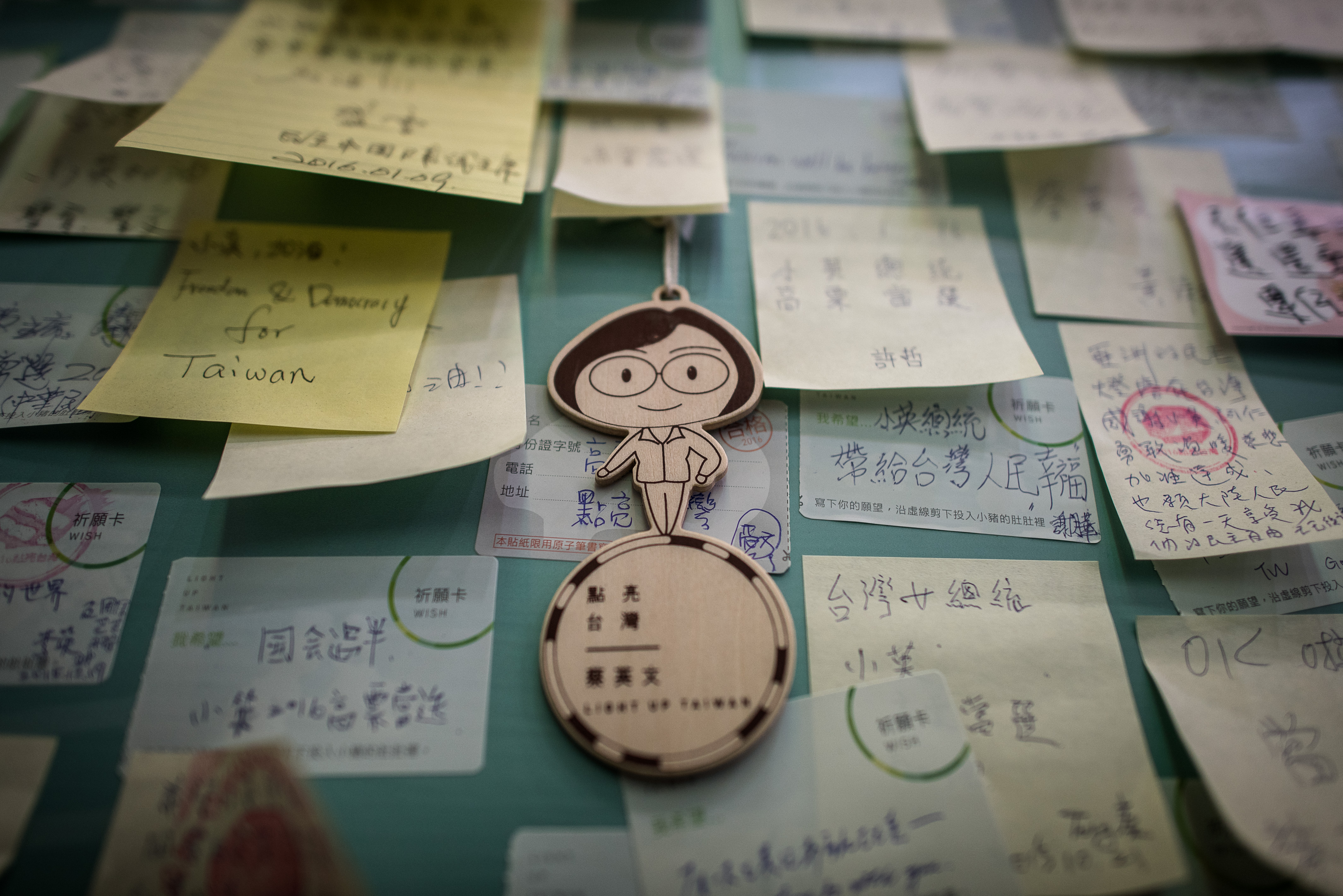 A figurine depicting Democratic Progressive Party presidential candidate Tsai Ing-wen hangs with messages of support in Taipei on Jan. 12, 2016 (Philippe Lopez—AFP/Getty Images)