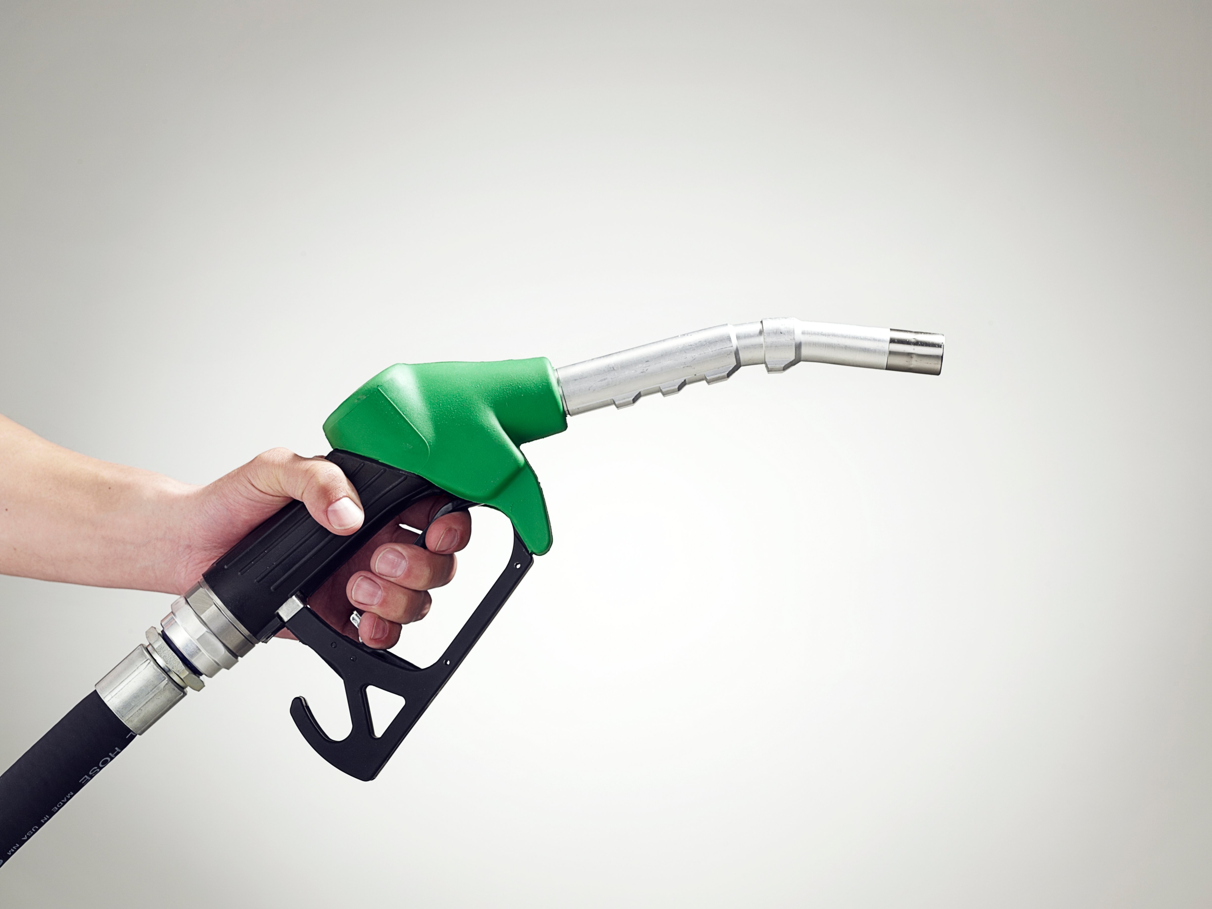green-gas-pump-hand-holding