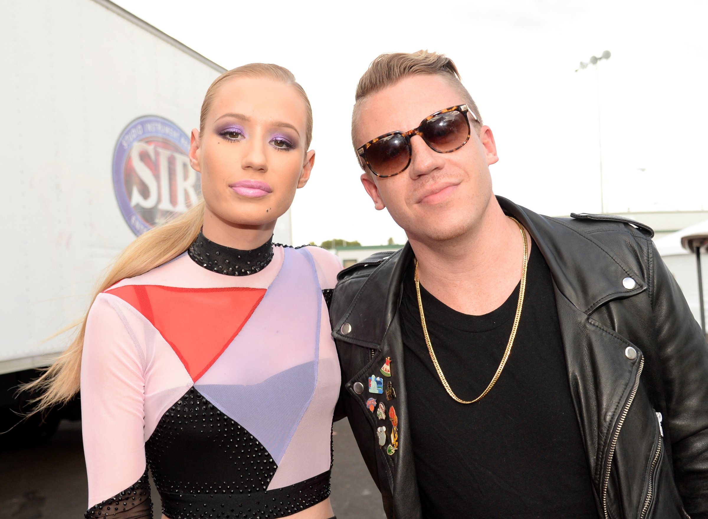 Rappers Iggy Azalea (L) and Macklemore attend the 2014 iHeartRadio Music Festival Village on September 20, 2014 in Las Vegas, Nevada.