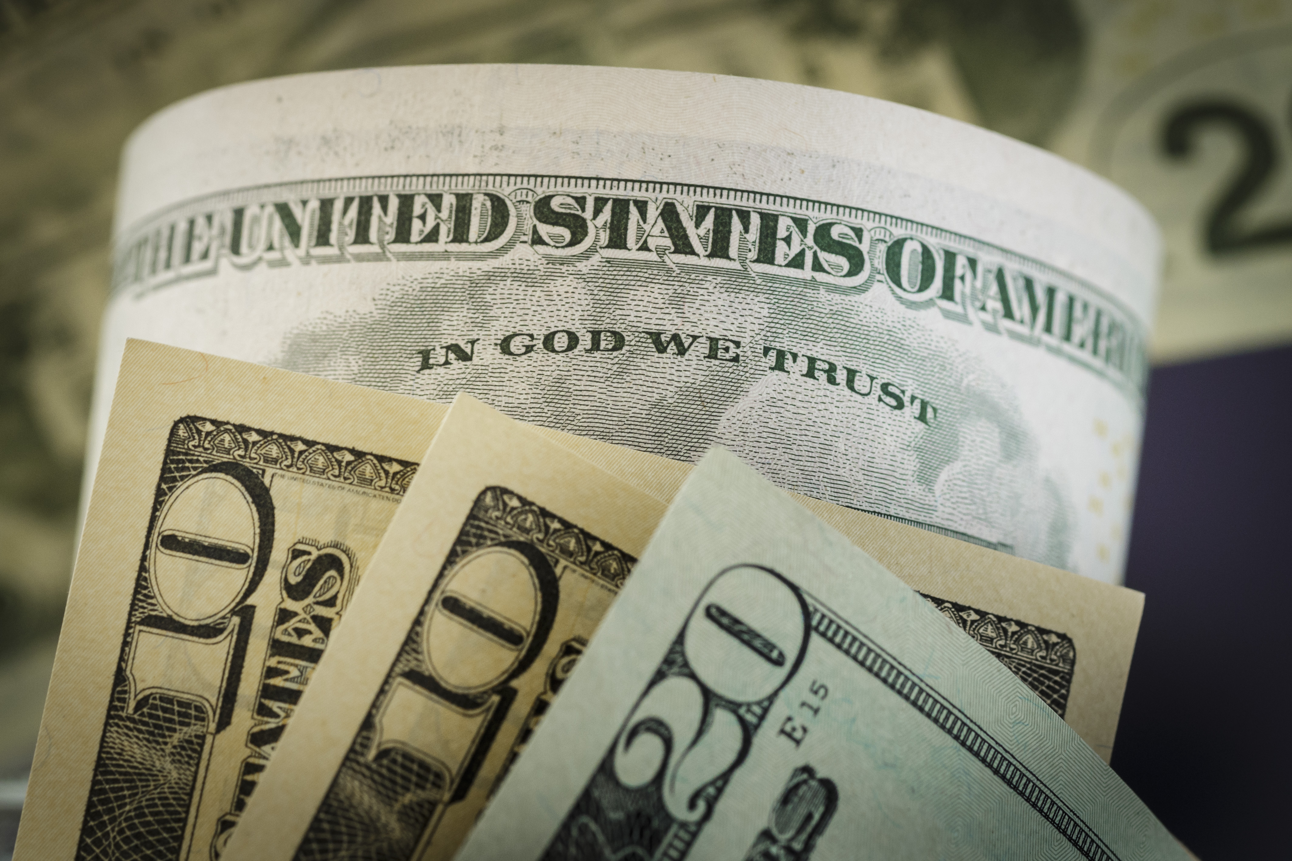 The writing ' In God we trust ' is seen on a dollar bill on August 14, 2015, in Berlin, Germany. (Thomas Trutschel—Photothek/Getty Images)