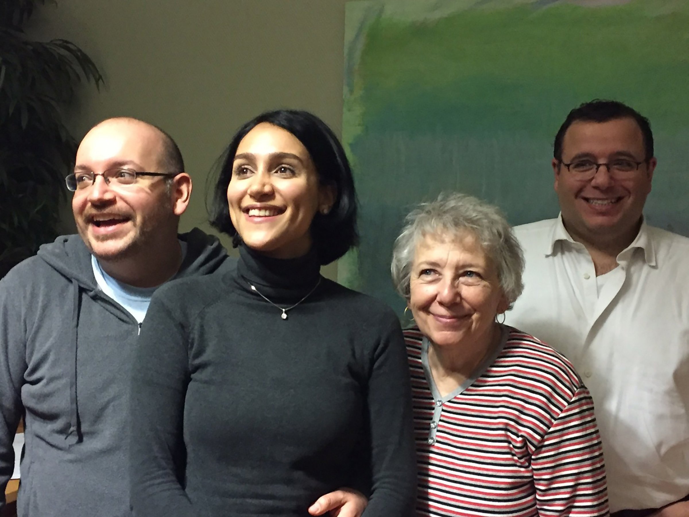 Washington Post journalist Jason Rezaian (left), freed after 18 months of incarceration in an Iranian prison, reunites with his wife Yeganeh Salehi, mother Mary Rezaian and brother Ali Rezaian, on Jan. 18, 2016.