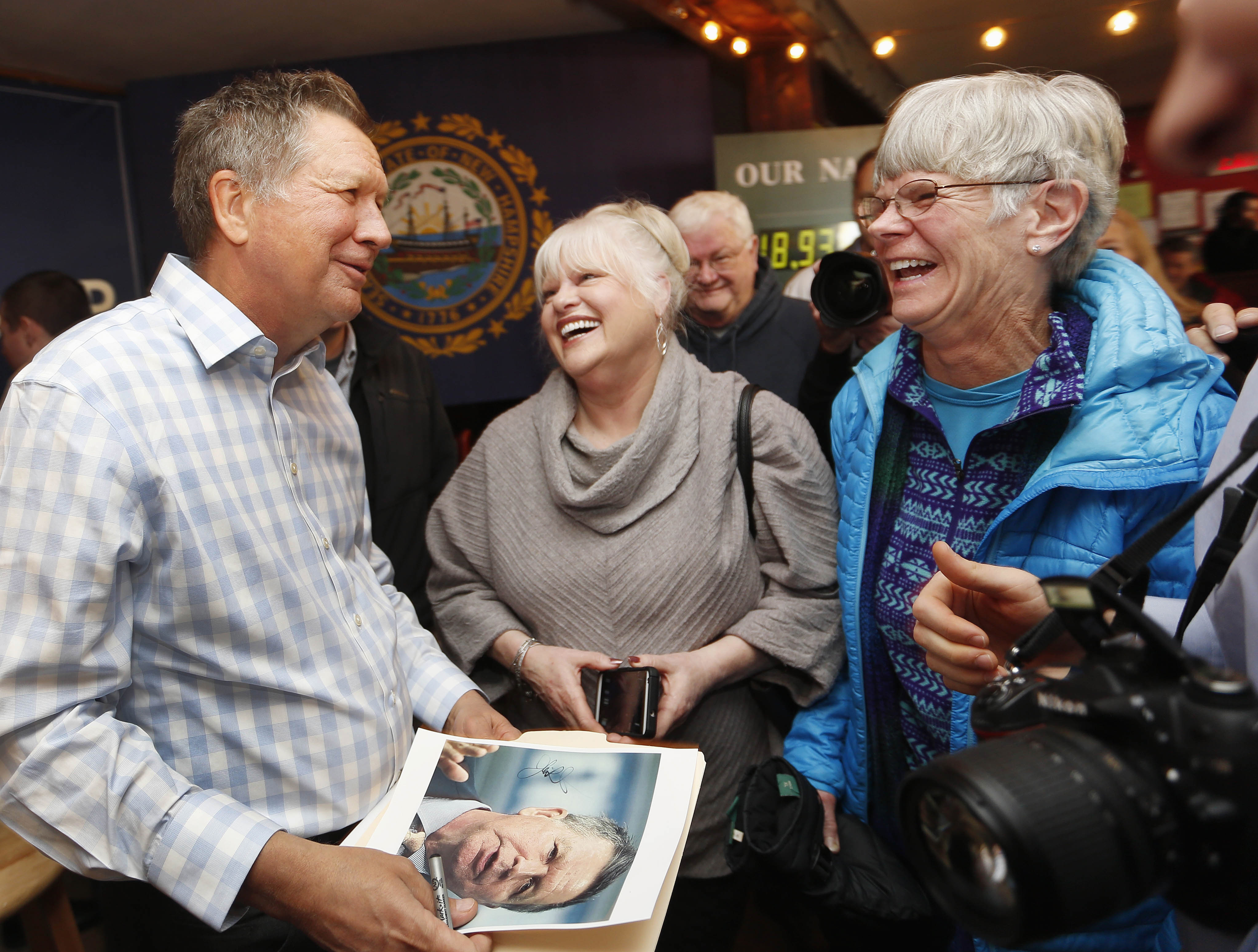 Republican presidential candidate and Ohio Governor John Kasich speaks to voters during a campaign stop at a music-club tavern called the Stone Church on Jan. 25, 2016, in Newmarket, N.H. (Jim Cole—AP)