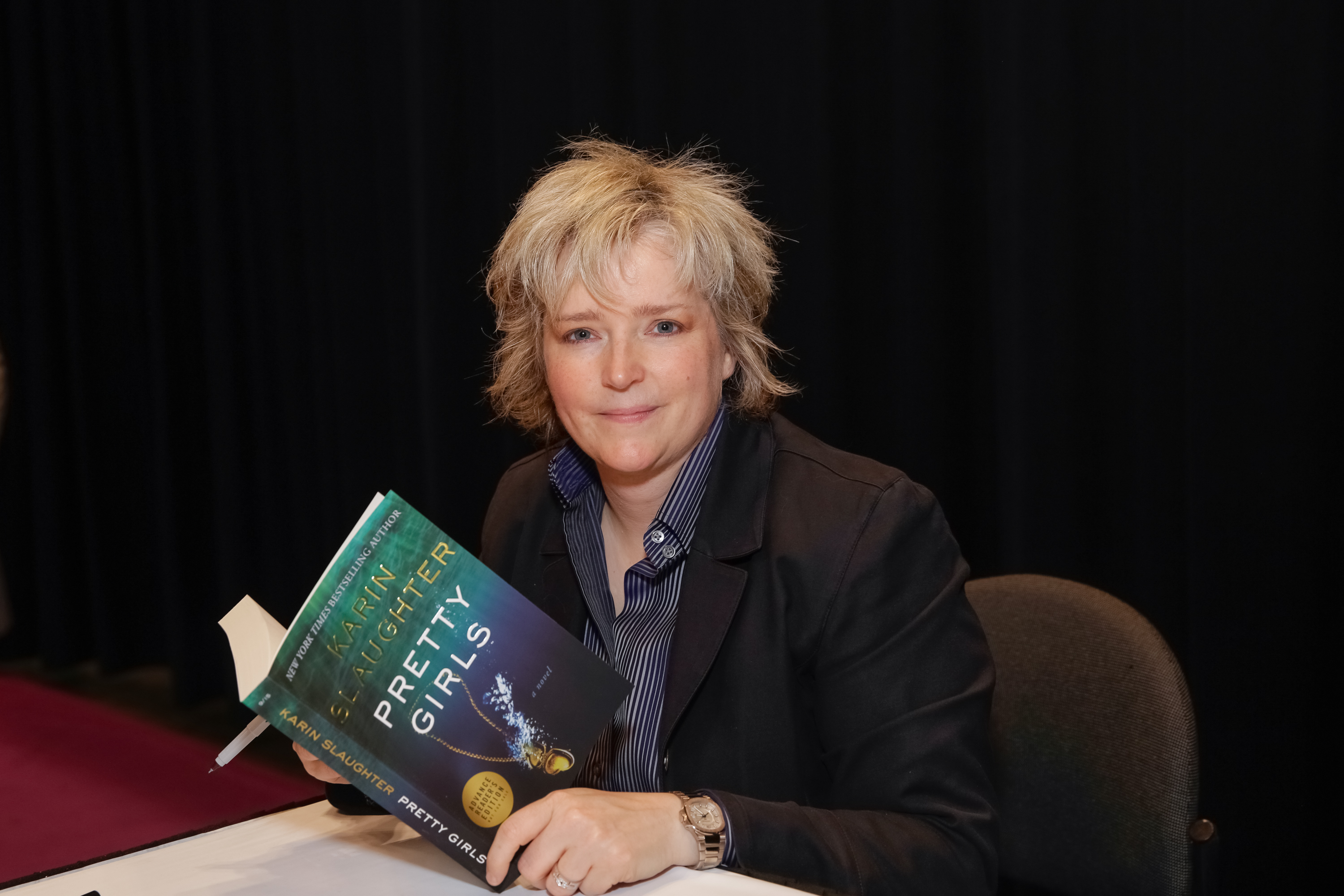 Author Karin Slaughter poses for photographs with her newest book during BookExpo America  in New York City on May 27, 2015.