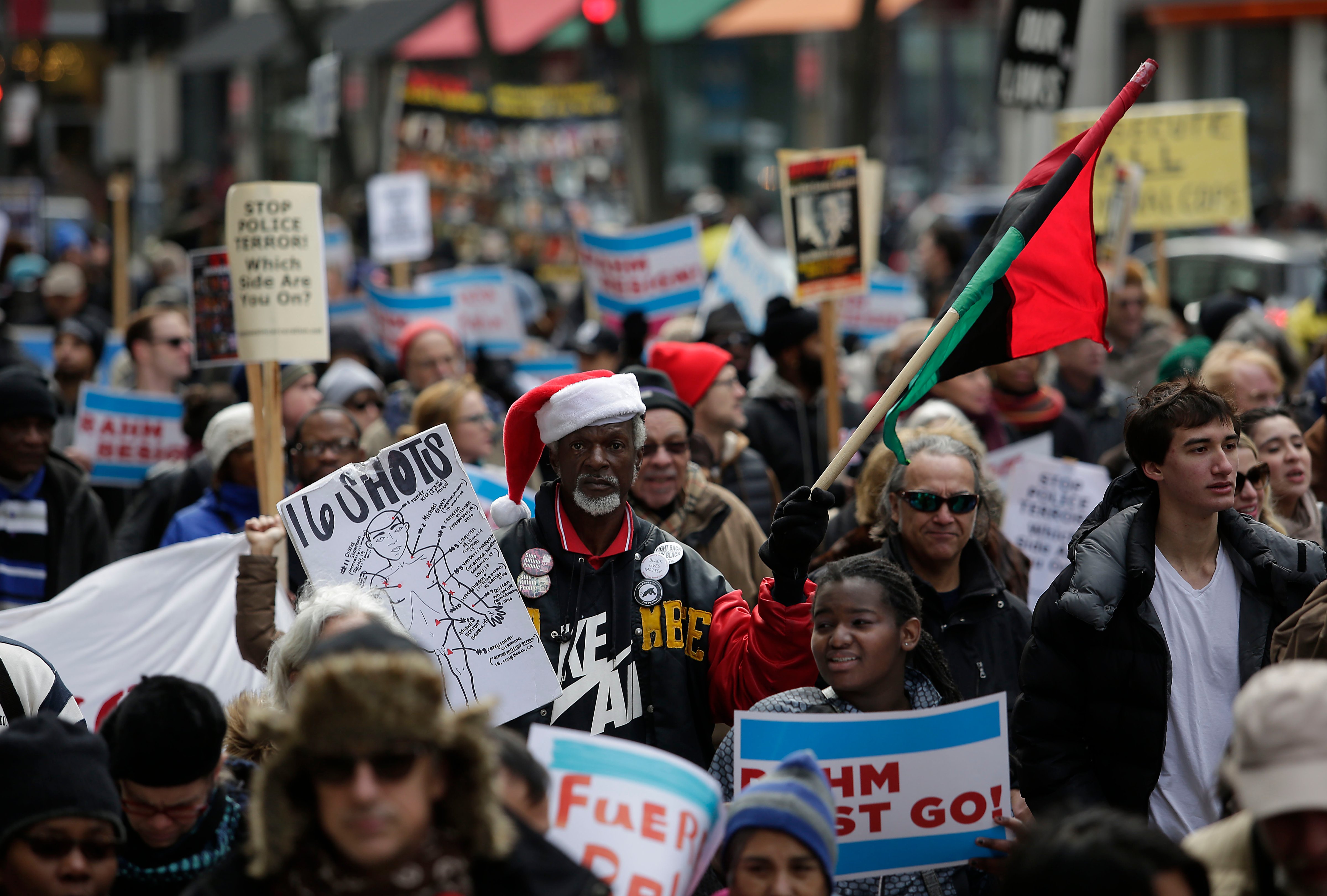 Demonstrators protest the shooting of Laquan McDonald in Chicago, on Dec. 24, 2015. (Joshua Lott—Getty Images)