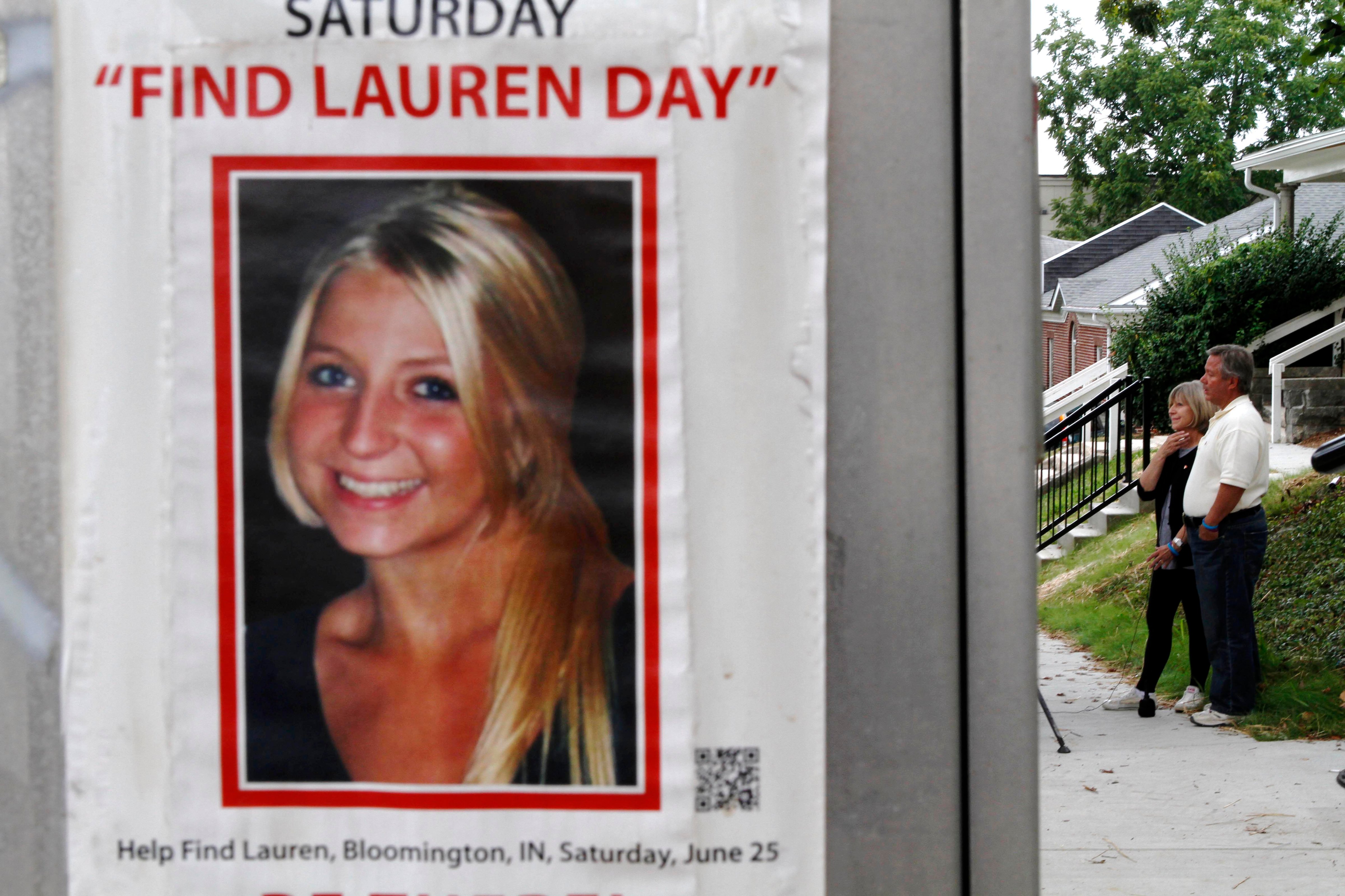 Charlene and Robert Spierer speak to reporters near a poster alerting people to their missing daughter, Lauren, in Bloomington, Ind. on Aug. 15, 2011 (Aaron Bernstein—AP.)