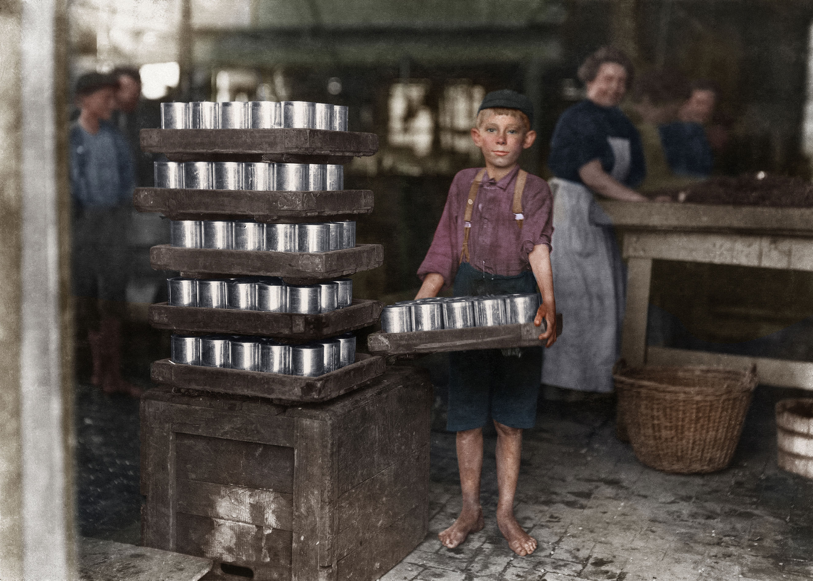 One of the small boys in J. S. Farrand P[ac]king Co. and a heavy load. J. W. Magruder, witness. July 1909.  Baltimore, Maryland.