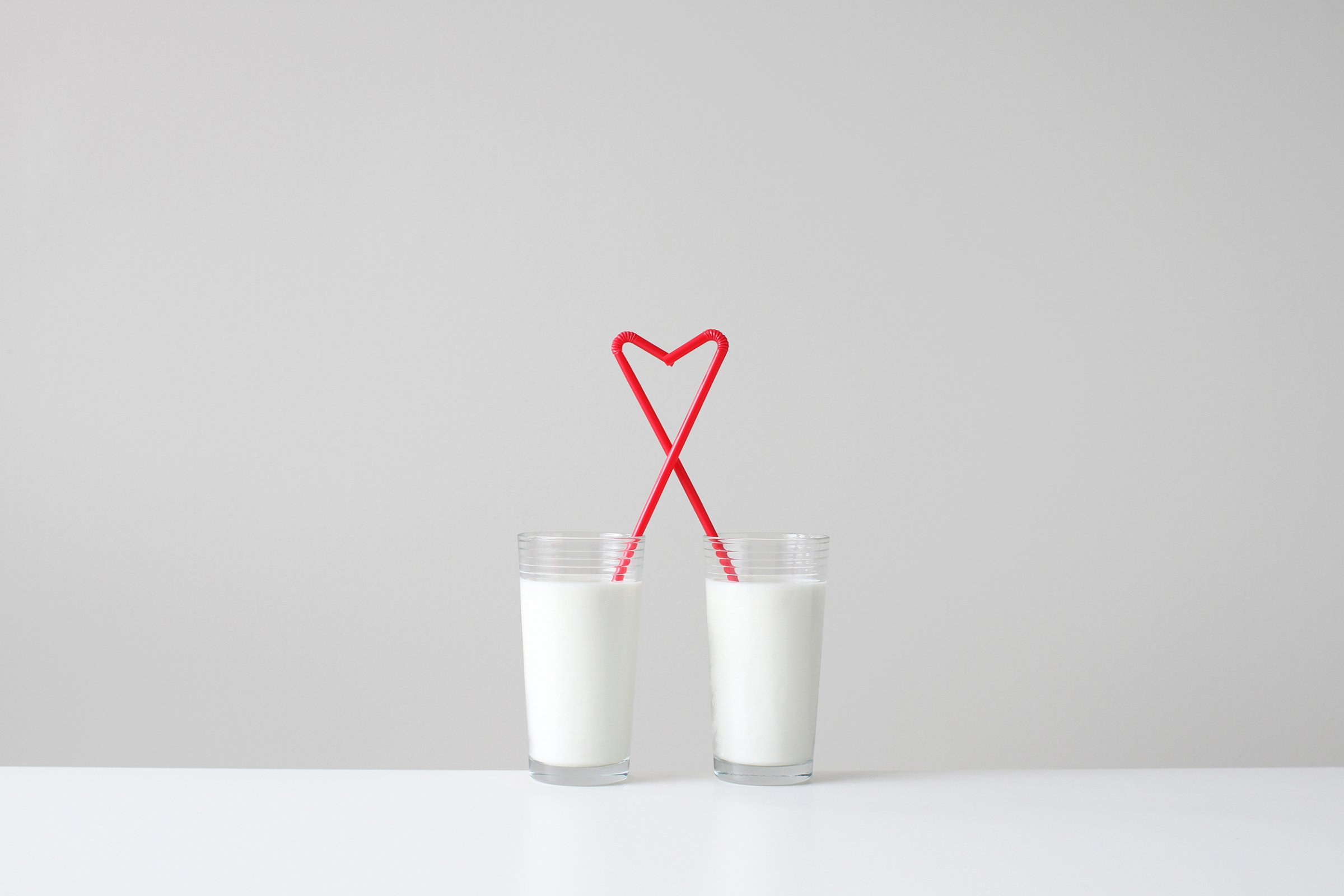 love two glasses milk hearts straws happiness relationships dating motto stock