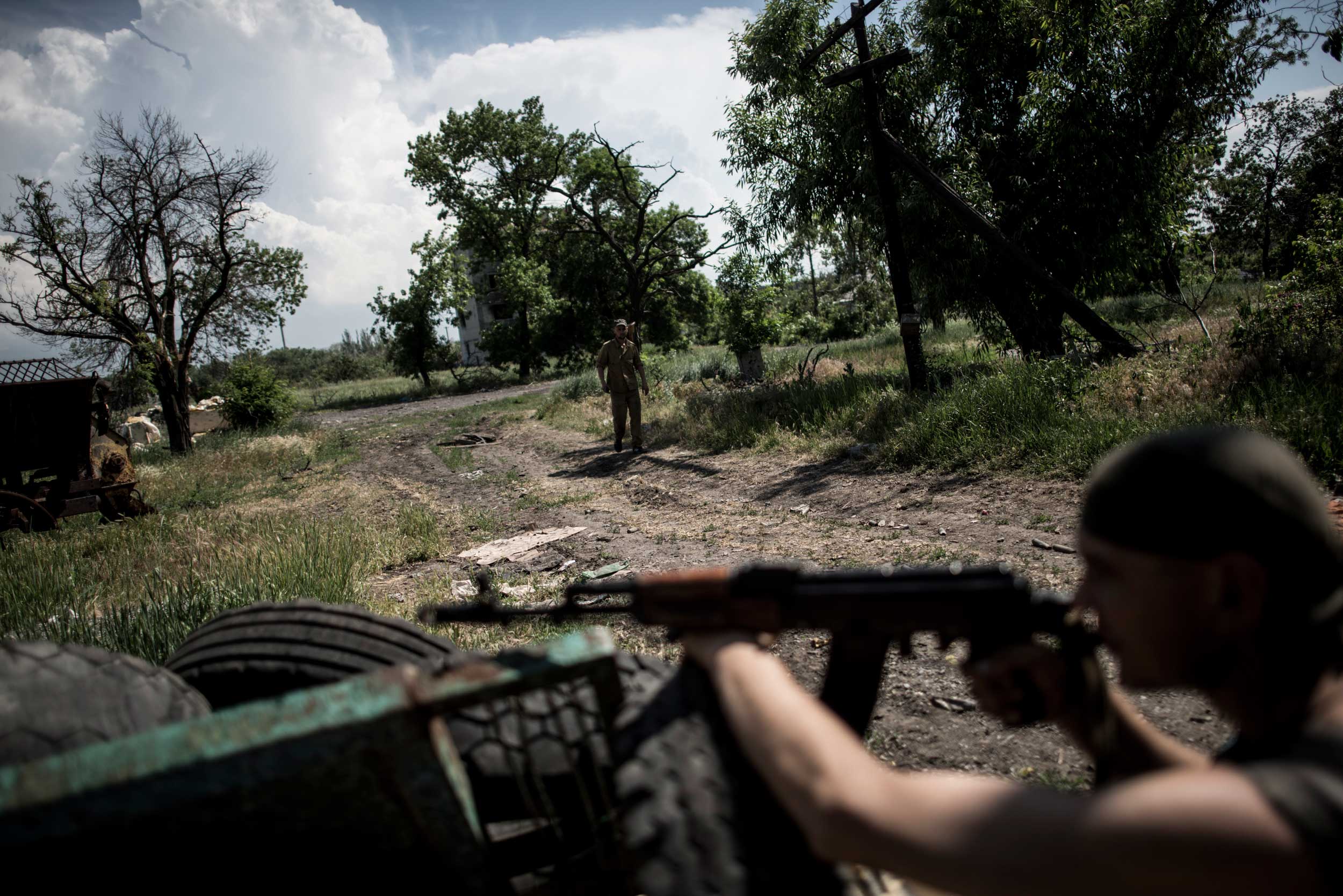 Ukrainian servicemen patrol the area near the division line with separatists in Marinka, near Donetsk, eastern Ukraine, June 5, 2015.