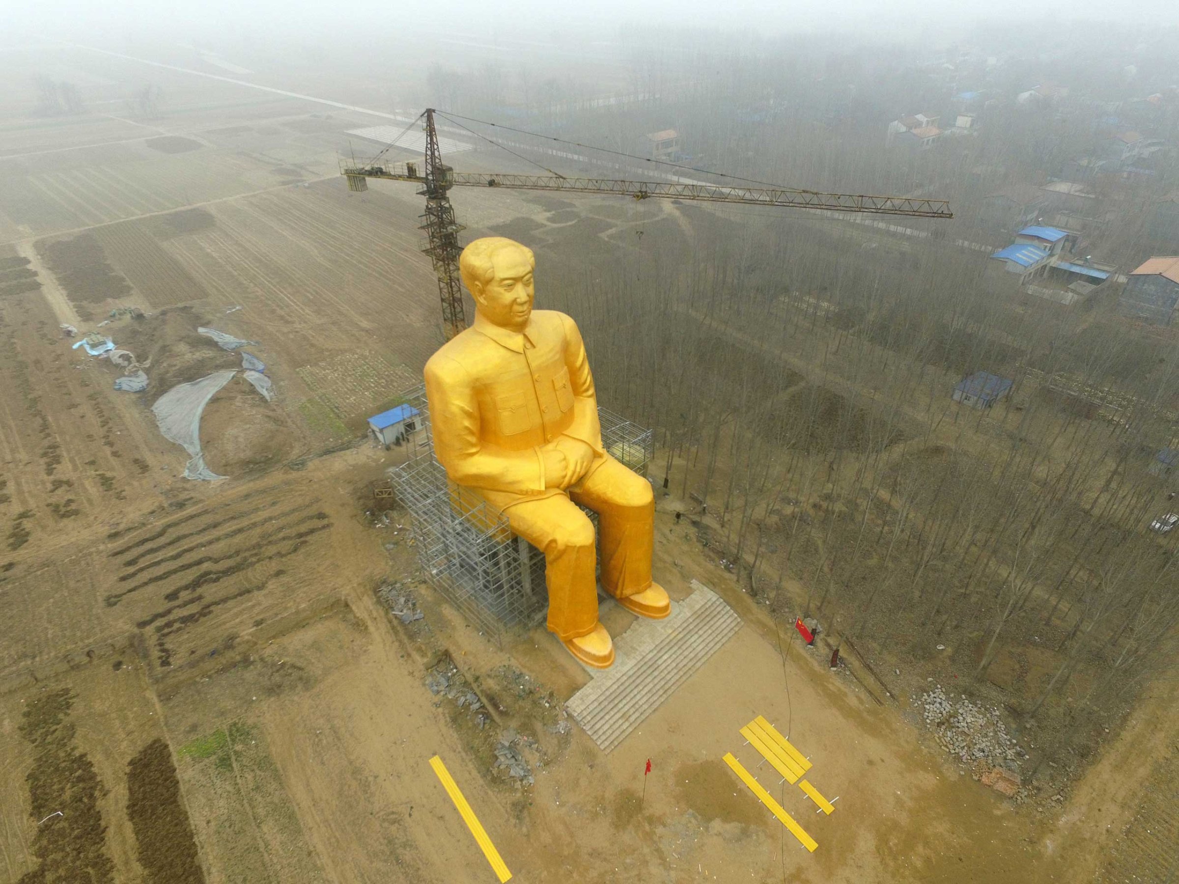 A huge statue of Chairman Mao Zedong, 36.6 meters in height, is seen under construction at Zhushigang village in Tongxu County, China, on Jan. 4.