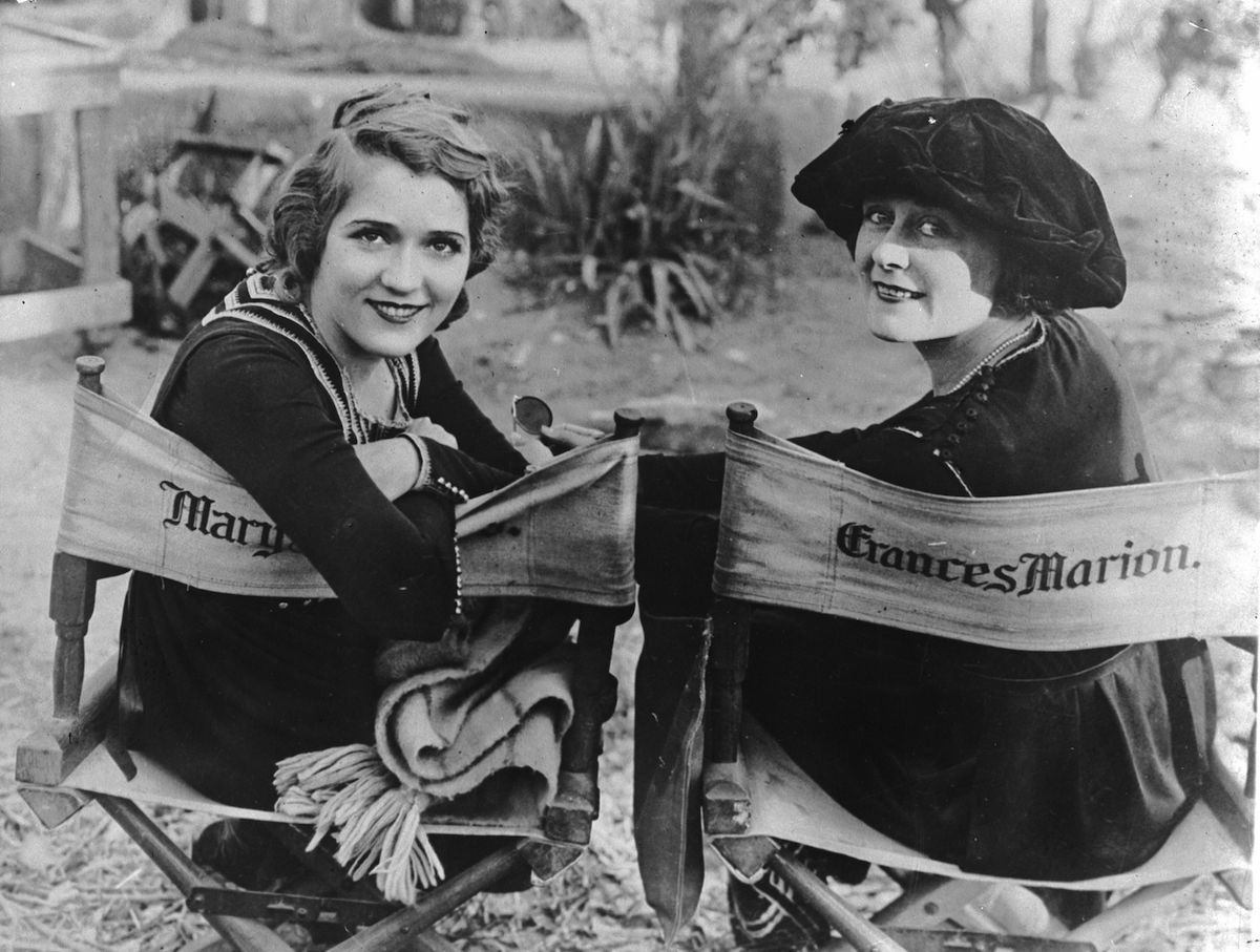 Actress Mary Pickford (1893 - 1979), at left, and Frances Marion (1887 - 1973) on the set of the United Artists war drama 'Straight is the Way' on Dec. 28, 1920 (General Photographic Agenc / Getty Images)