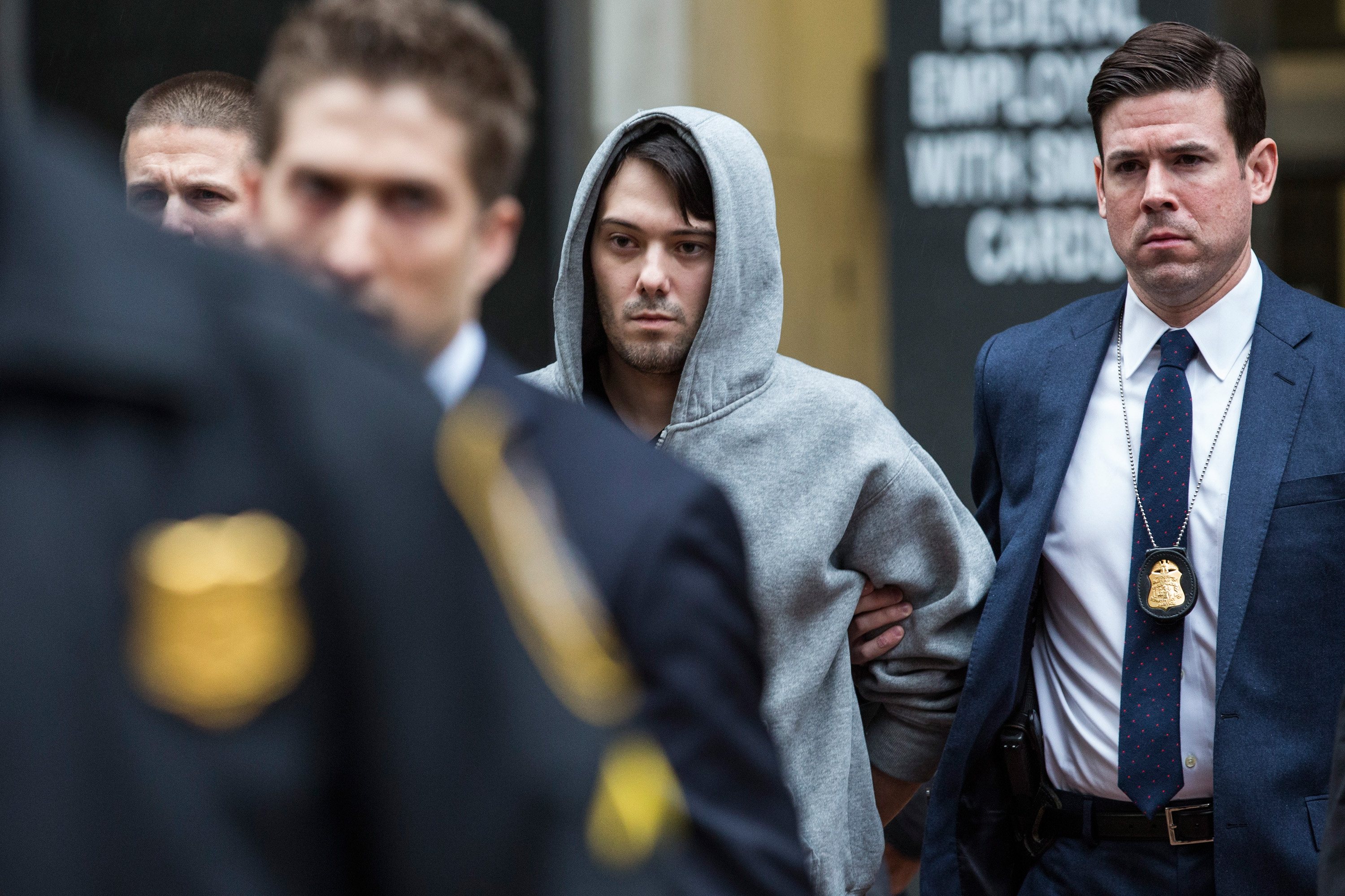 Martin Shkreli is brought out of 26 Federal Plaza by law enforcement officials after being arrested for securities fraud on Dec. 17 in New York City. (Andrew Burton—Getty Images)