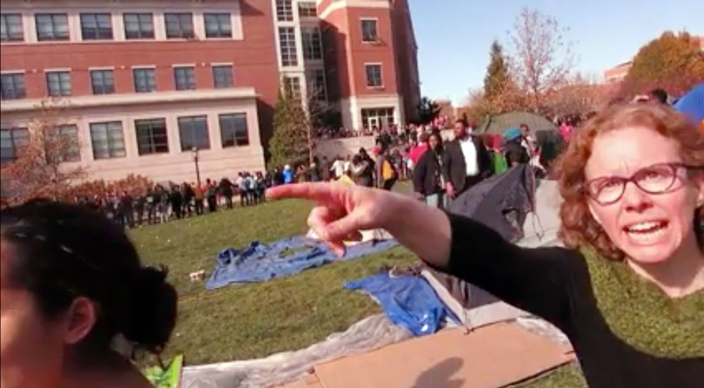 Melissa Click confronts Mark Schierbecker and later calls for "muscle" to help remove him from the protest area in Columbia, Mo. on Nov. 9, 2015.