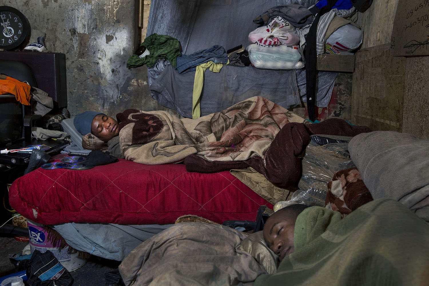 African migrants from Zimbabwe sleep in tight quarters, July 12, 2015.