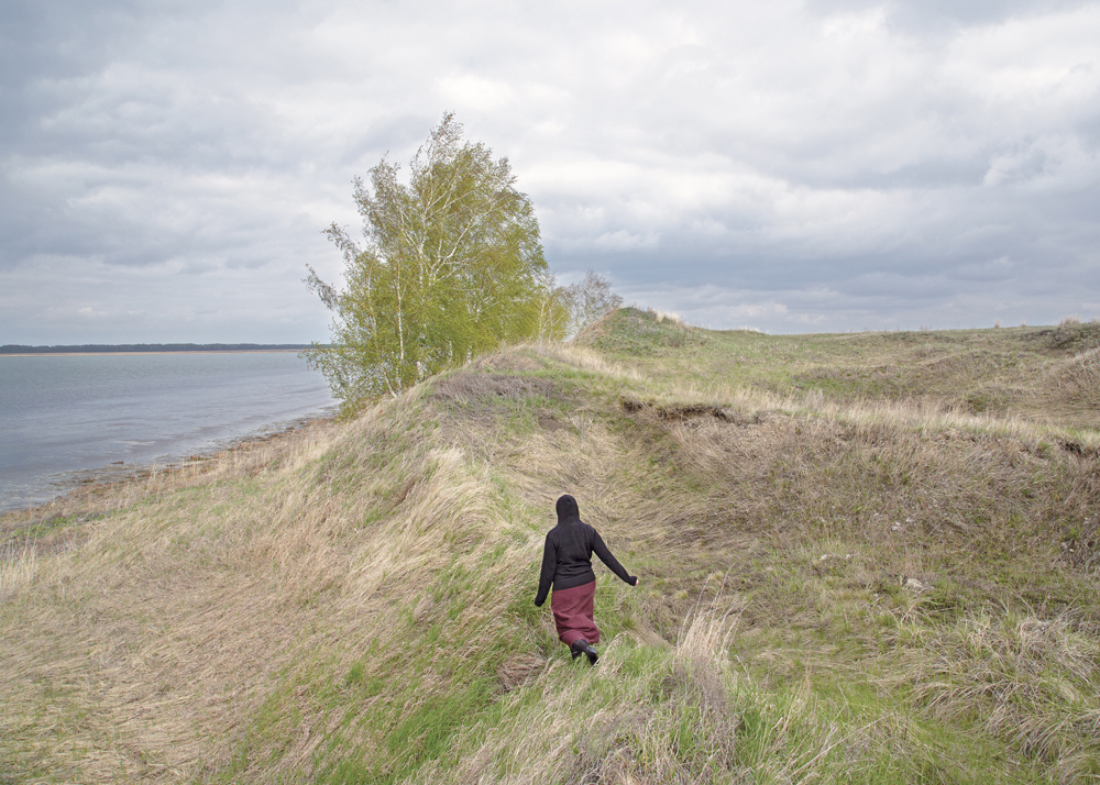 A woman, 24, at the Crooked Lake in Petrovka, Omsk Oblast, Russia, 2014.