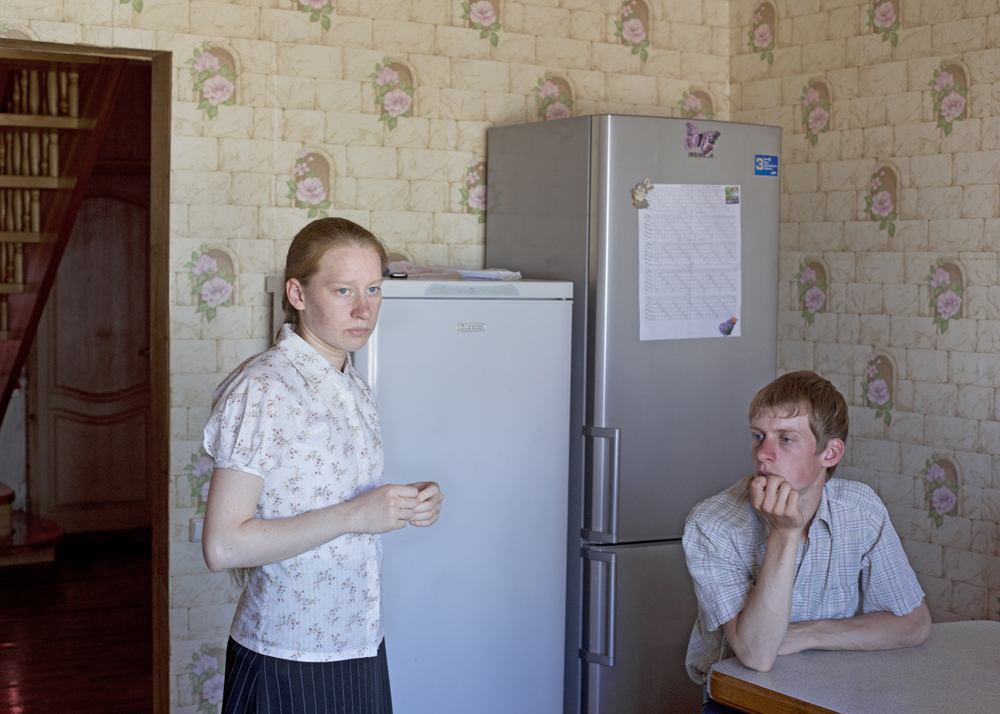 A brother and sister shortly before the final rehearsal, one day before the Sängerfest, or singer festival, a competition of singers or singer groups in Petrovka, Russia, 2014.