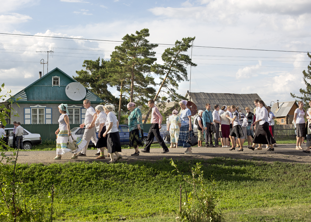 A crowd of Russian Mennonites after a singing festival in the woods of Iwanovka, Russia, 2014.