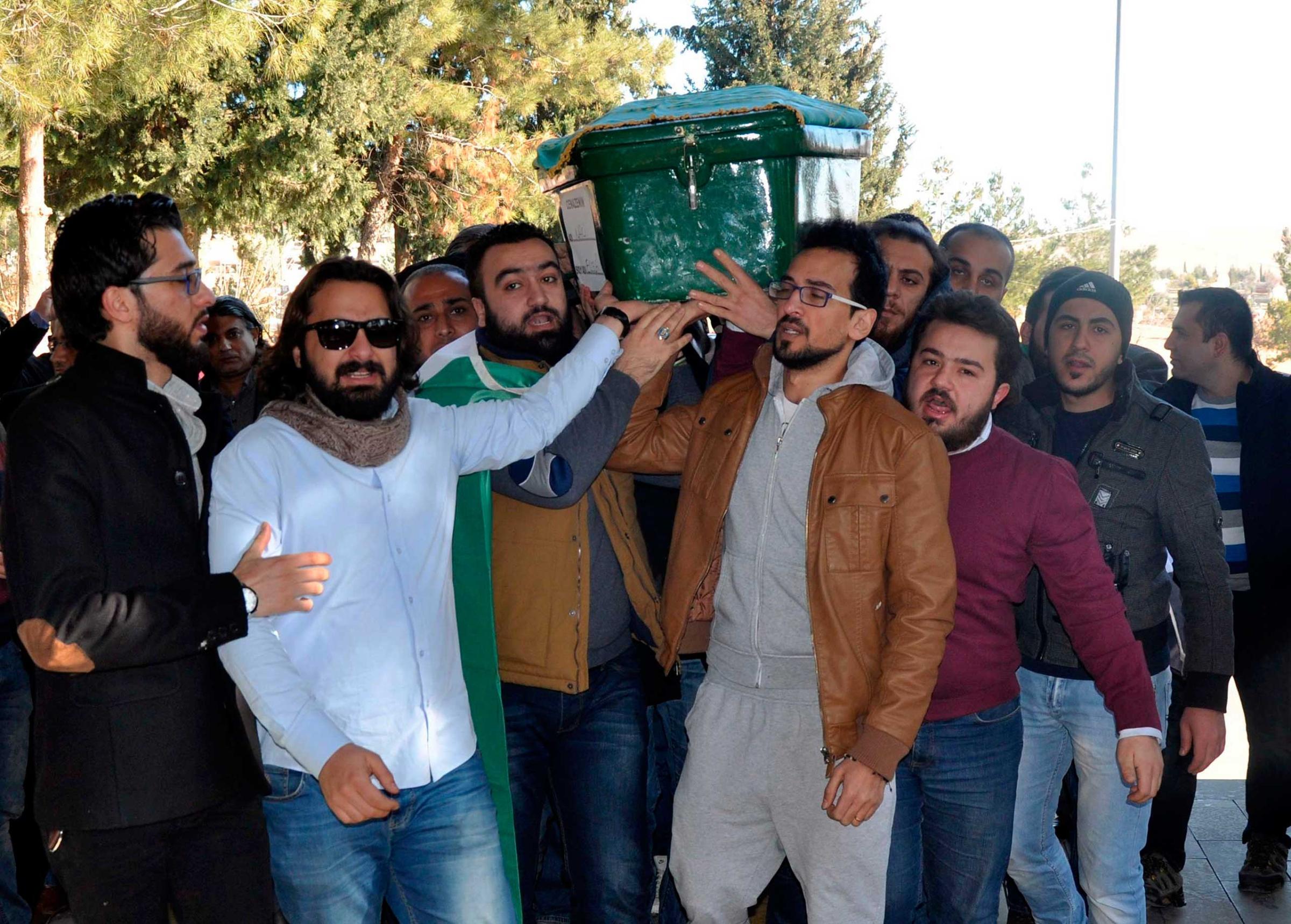 Men carry the coffin of filmmaker Naji Jerf, a citizen journalist with the anti-ISIS activist group Raqqa is Being Slaughtered Silently, who was killed Dec. 27 in Gaziantep, Turkey, on Dec. 28, 2015.