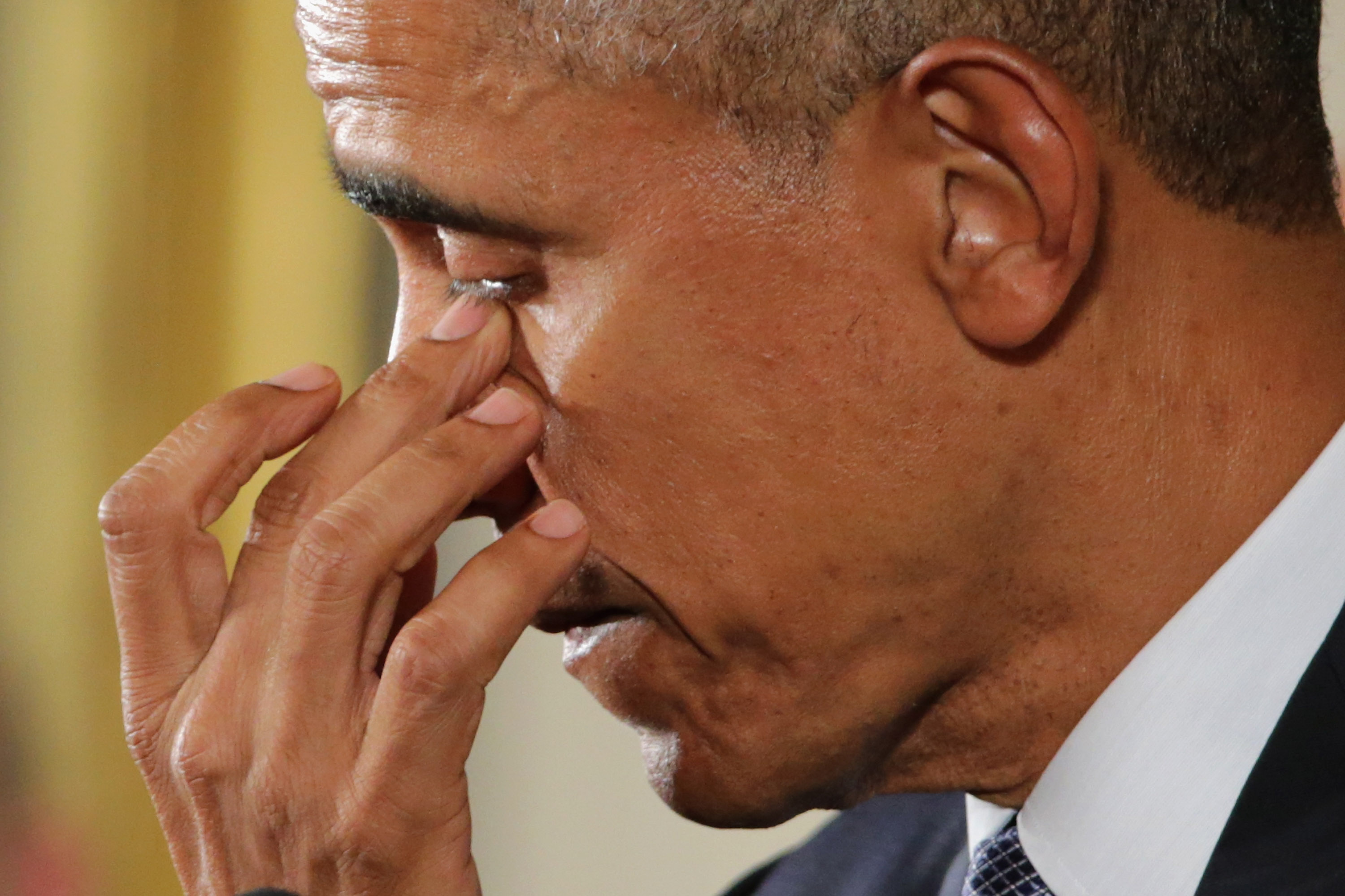 U.S. President Barack Obama wipes away tears as talks about the victims of the 2012 Sandy Hook Elementary School shooting and about his efforts to increase federal gun control in the East Room of the White House in Washington, D.C., on Jan. 5, 2016 (Chip Somodevilla—Getty Images)
