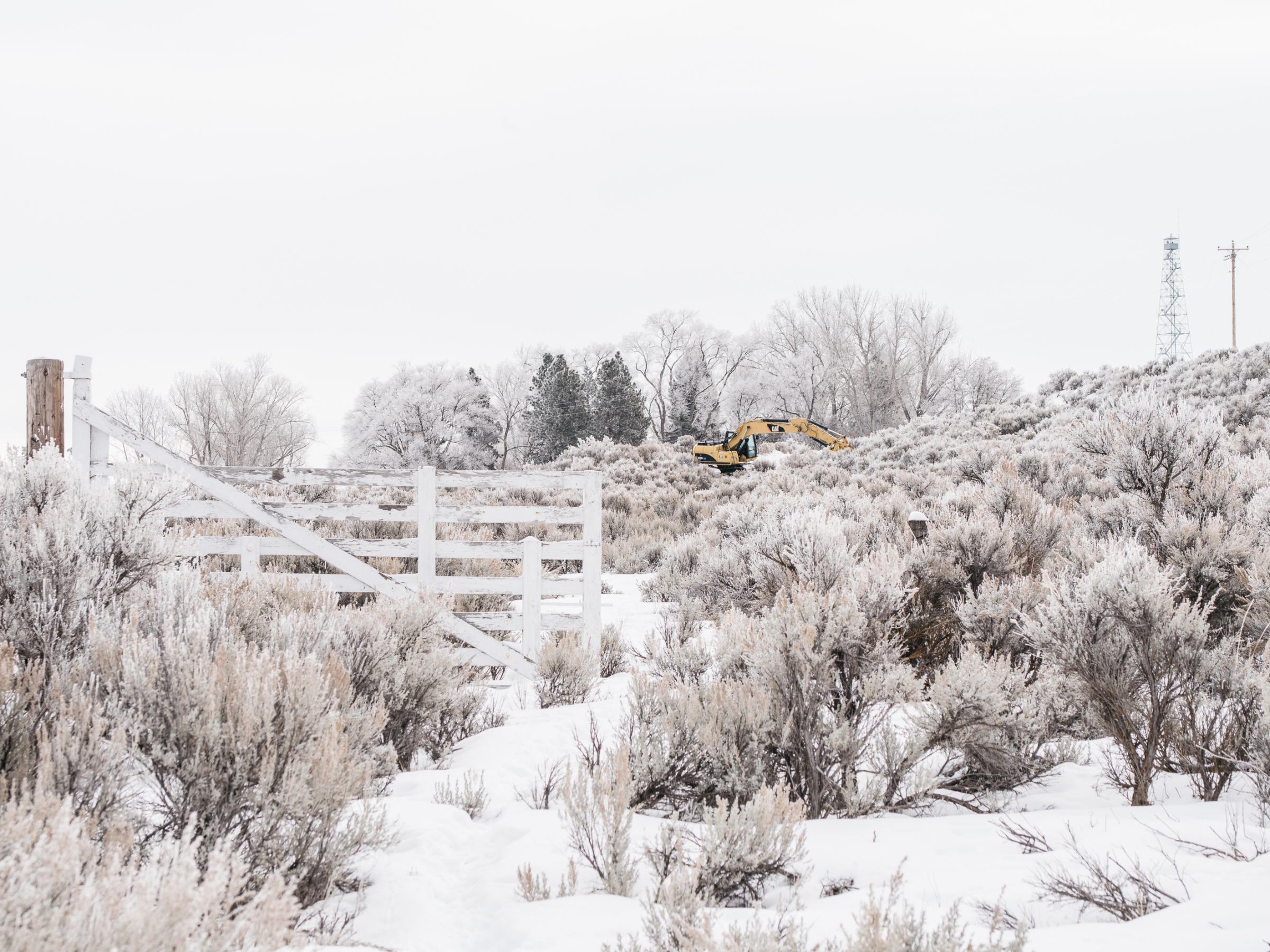 A government CAT Excavator is parked to blockade a side road entrance to the Malheur National Wildlife Refuge on Jan. 12, 2016.