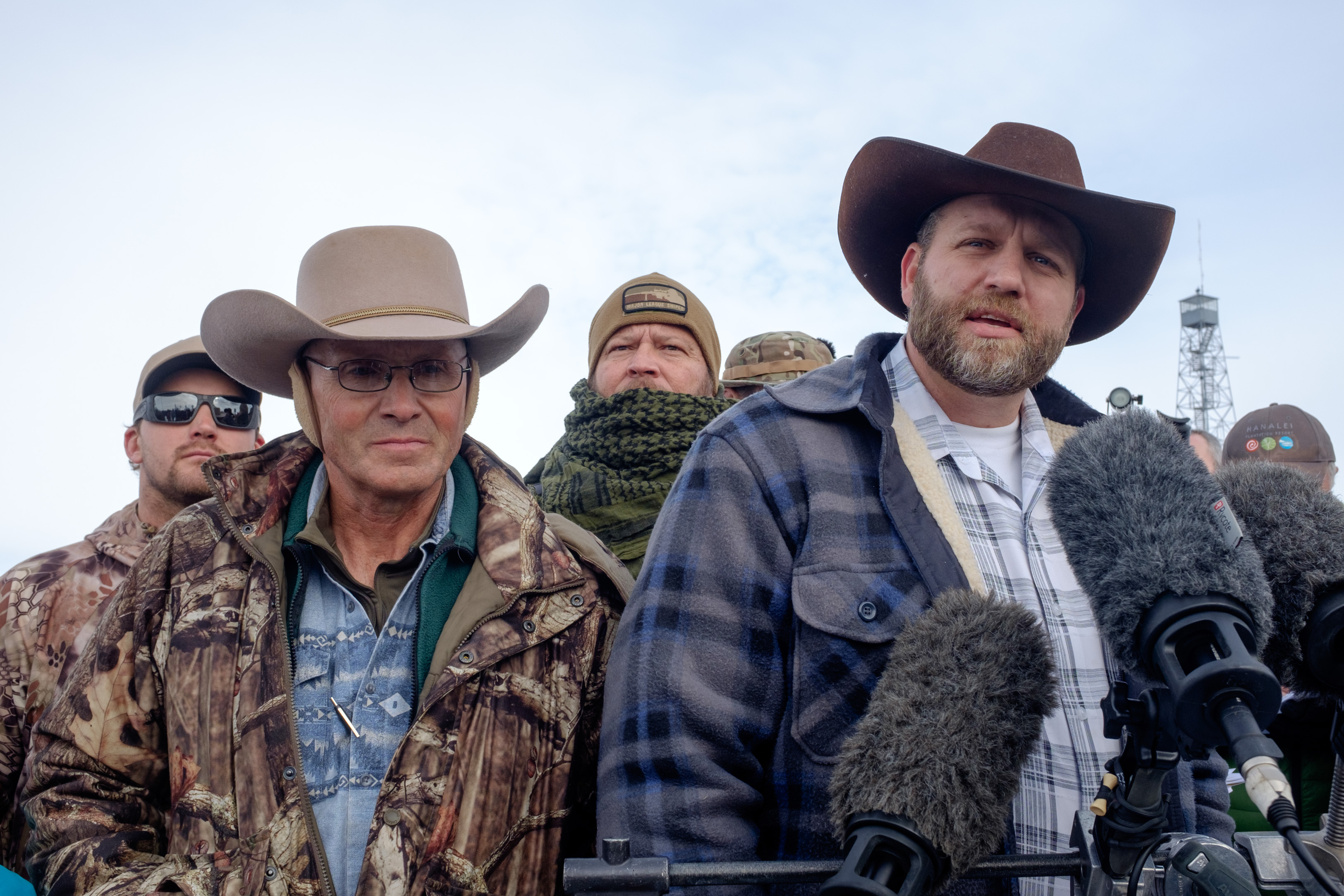 Ammon Bundy(R), leader of a group of armed anti-government protesters speaks to the media as other members look on at the Malheur National Wildlife Refuge near Burns, Ore., on Jan. 4, 2016. (Rob Kerr—AFP/Getty Images)