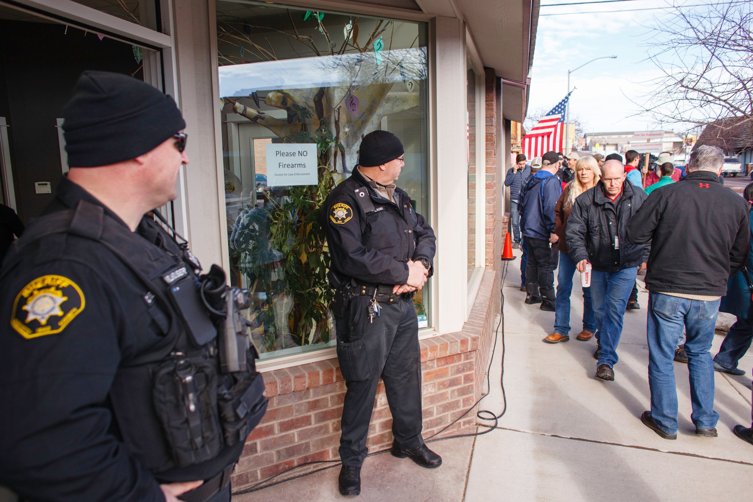 Washington County Sheriff Deputies monitor the public outside of the Harney County Chamber of Commerce where a press conference was being held in Burns, Oregon, on Jan. 27, 2016.