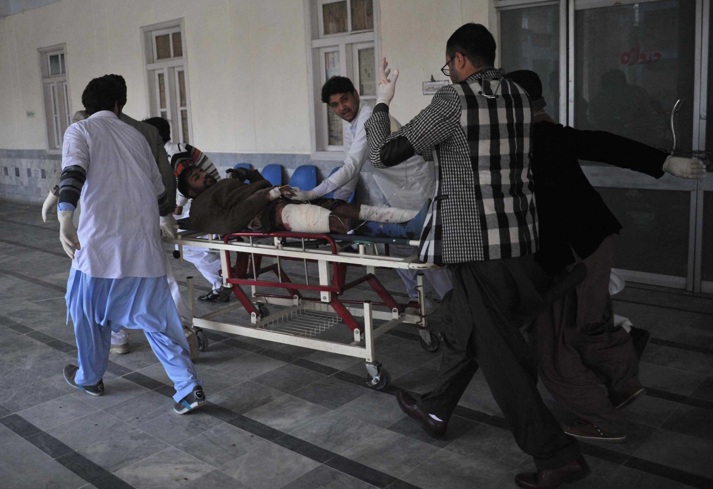 Rescuers move an injured man at a hospital following an attack by gunmen at Bacha Khan university in Charsadda, in northwest Pakistan, Jan. 20, 2016.
