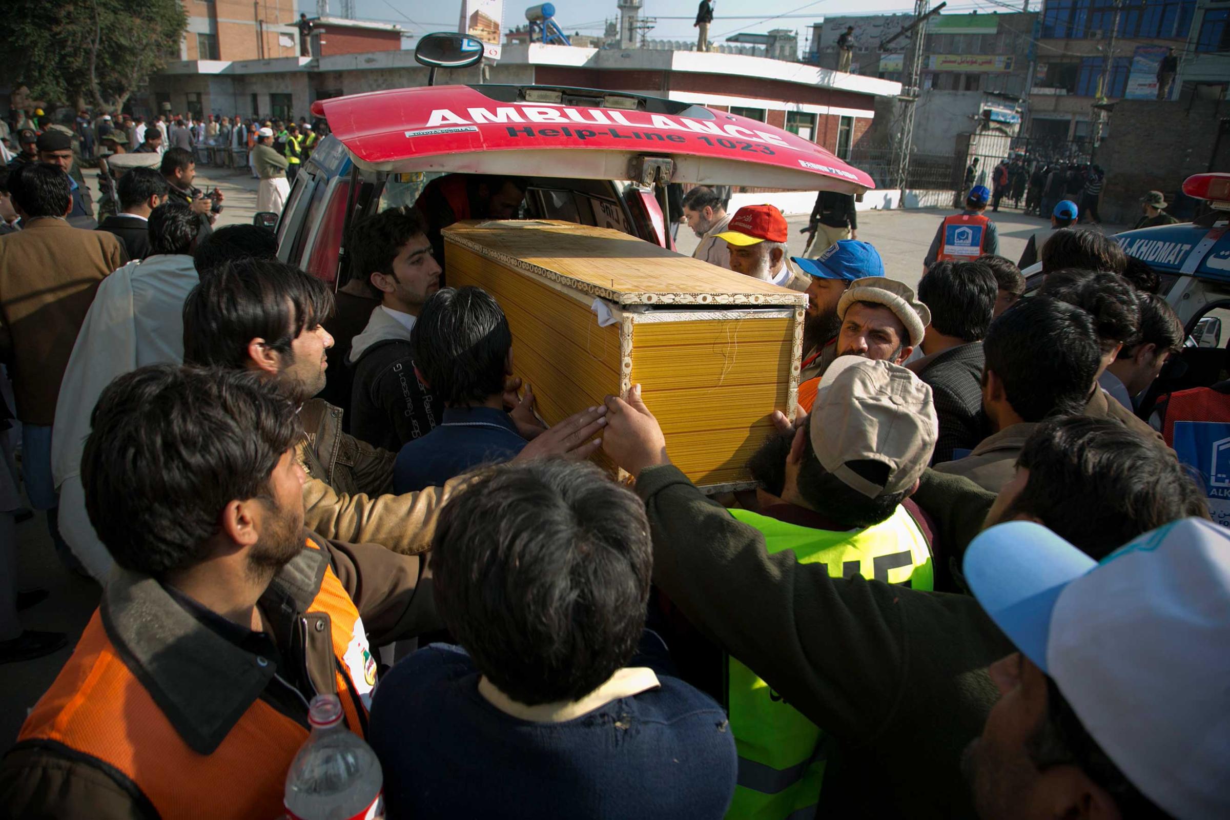 People carry a coffin of a victim killed in the Bacha Khan University attack from a local hospital in Charsadda, Pakistan, Jan. 20, 2016.