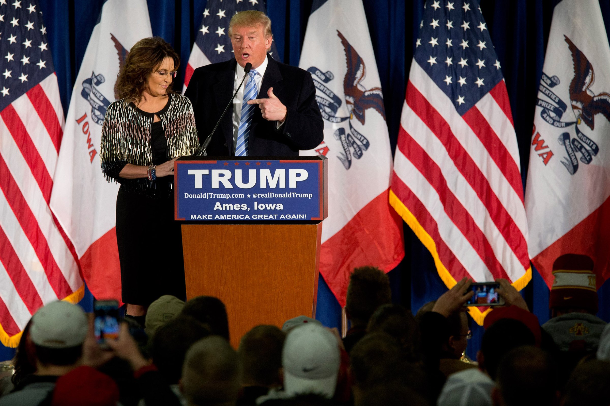 Former Alaska Gov. Sarah Palin, left, endorses Republican presidential candidate Donald Trump during a rally at the Iowa State University, Tuesday, Jan. 19, 2016, in Ames, Iowa. (AP Photo/Mary Altaffer)