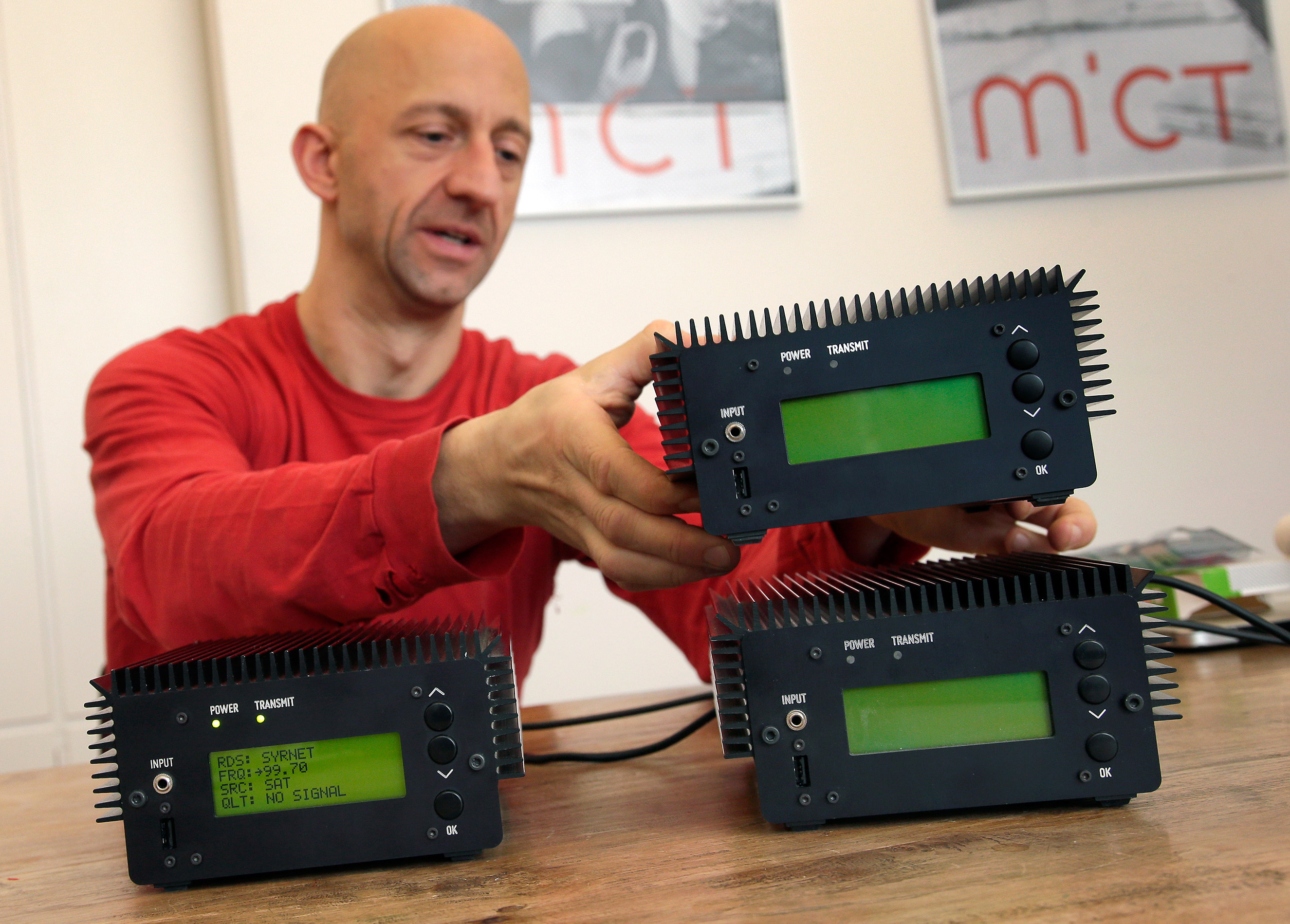 Philipp Hochleichter of the Media in Cooperation and Transition organization holds a Pocket FM Radio Transmitter in Berlin, Germany, Dec. 21, 2015. As part of the Syrian radio networking project, MICT has designed small modular FM transmitters. (Michael Sohn—AP)