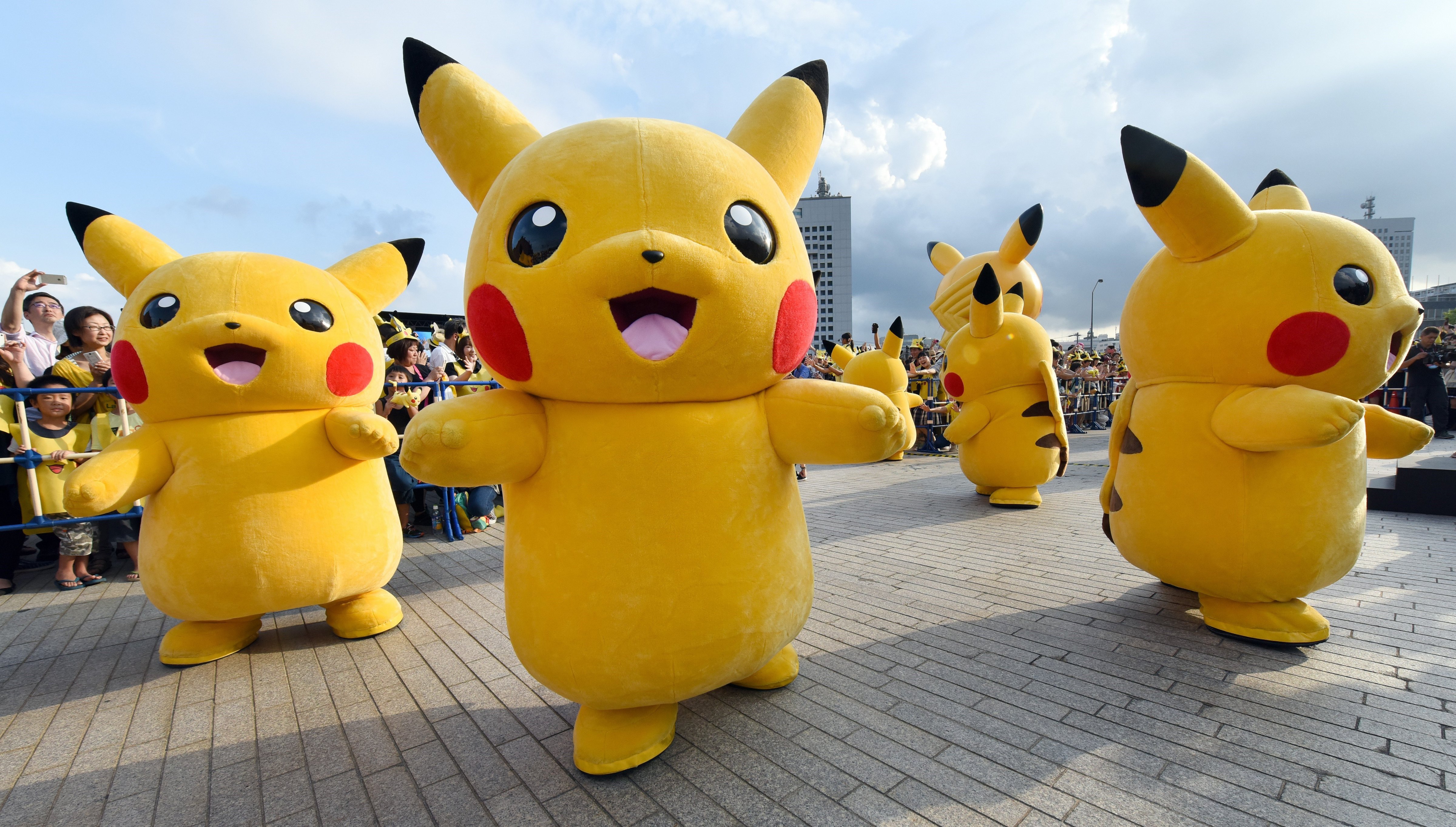 Dozens of people dressed up as Pikachu, the famous character of Nintendo's videogame software Pokemon, dance with fans as the final of a nine-day 
