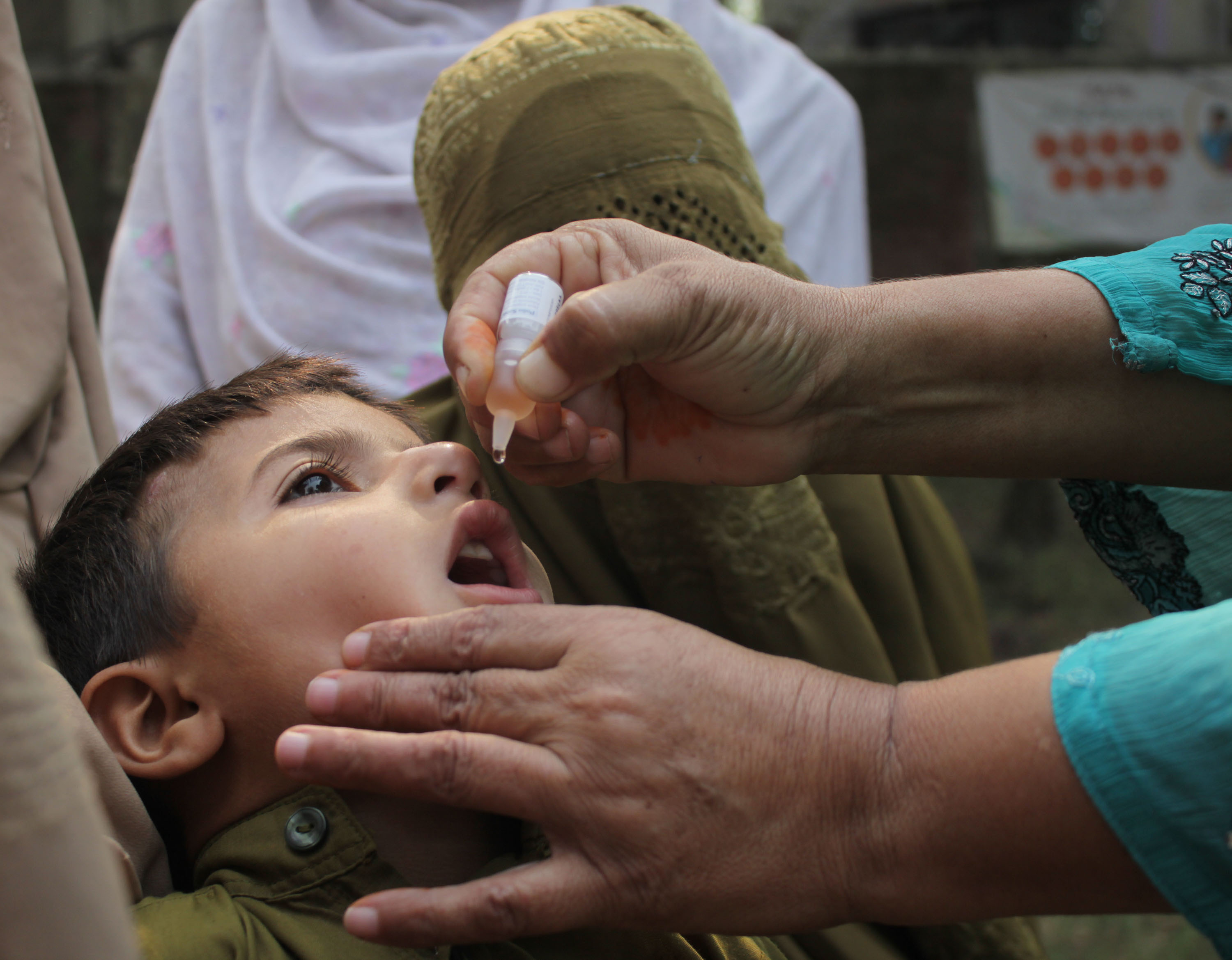 All good now: A child in Lahore, Pakistan receives the polio vaccine in 2014 (Pacific Press/LightRocket/Getty Images)