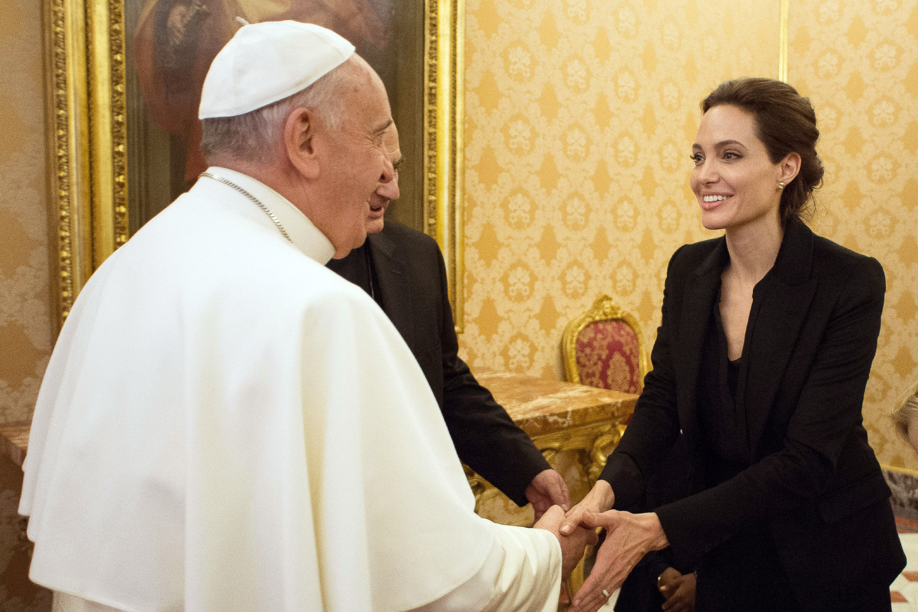 Pope Francis greets Angelina Jolie at the Vatican on Jan. 8, 2015.
