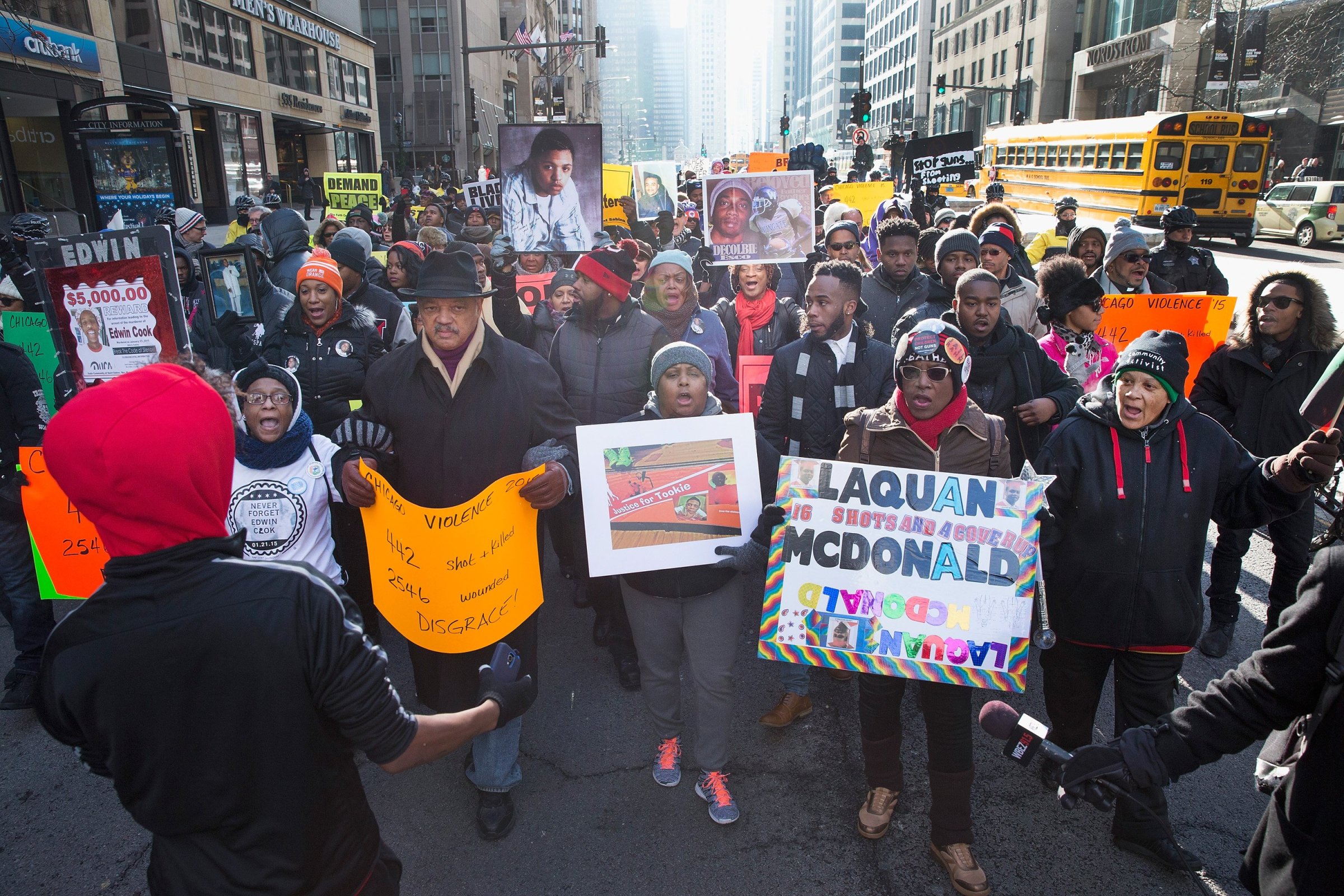 Rev. Jesse Jackson helps to lead demonstrators calling for an end to gun violence as they march through downtown Chicago on Dec. 31, 2015. The shooting deaths by police of a 19-year-old college student Quintonio LeGrier and his 55-year-old neighbor Bettie Jones and a recently released video showing the shooting of 17-year-old Laquan McDonald by Chicago Police officer Jason Van Dyke have sparked dozens of protests in the city.