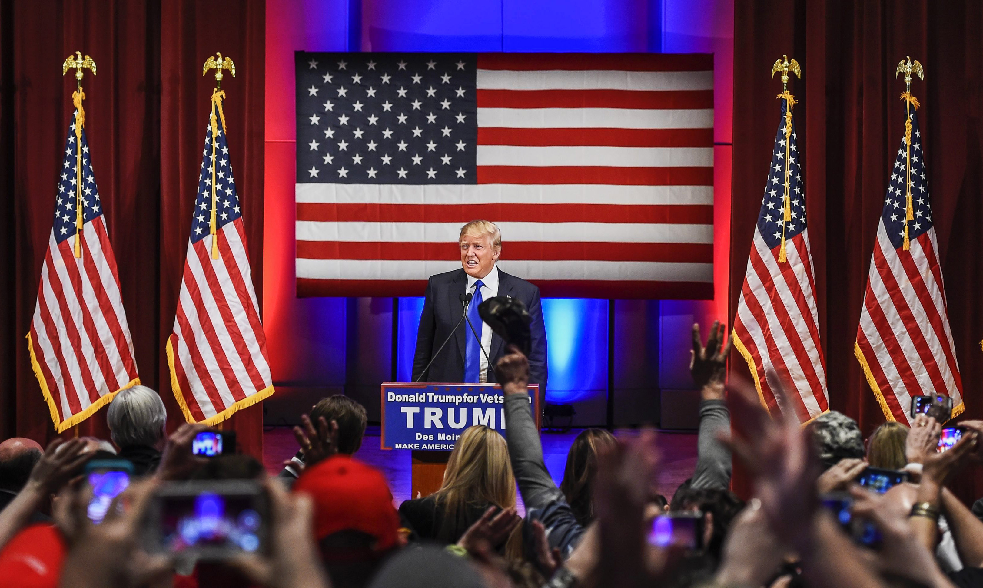 Republican presidential candidate Donald Trump is applauded at a special event to benefit veterans organizations at Drake University in Des Moines, Iowa on Jan 28, 2016. (Larry W. Smith—EPA)