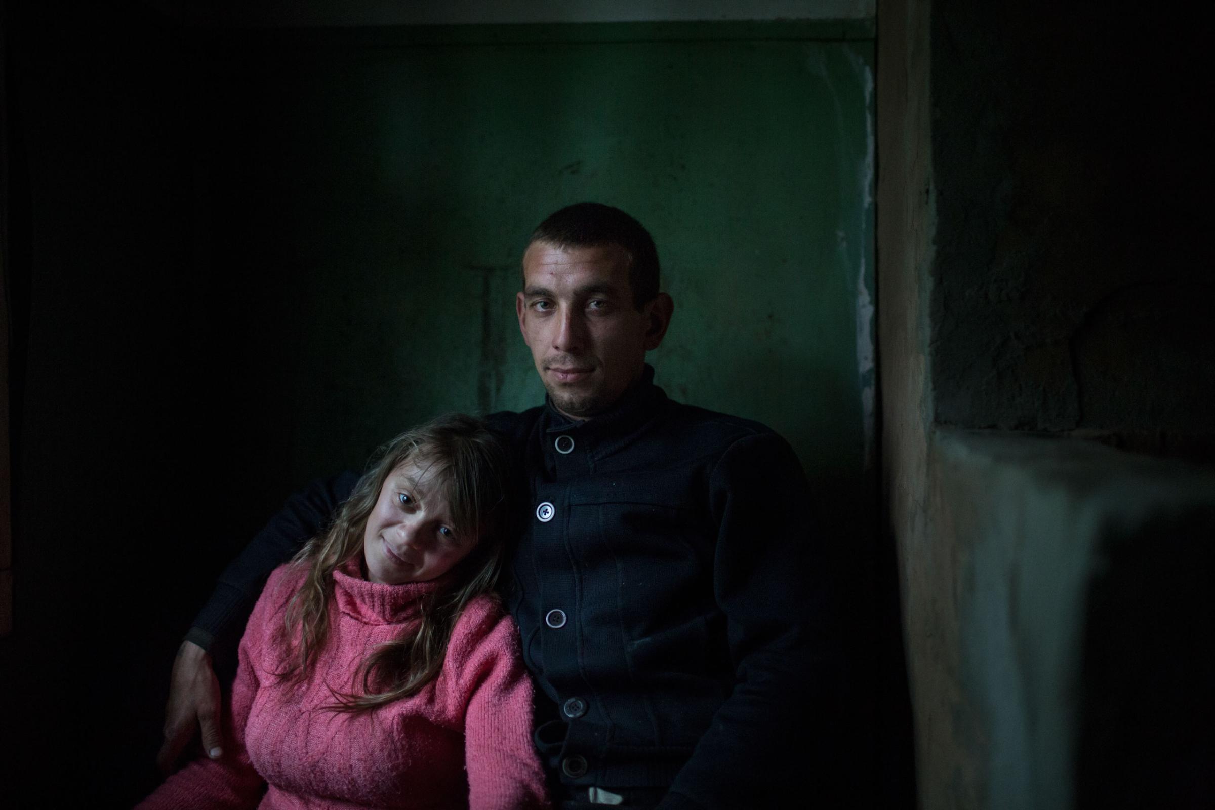 A family, Olga and Alexey Sergeev is pictured in a former Soviet river dispatching office i Ust-Vologodskoye. Alexey is a worker at local businessman Alexander Zheltov's (an owner of local river fleet and ports) company
