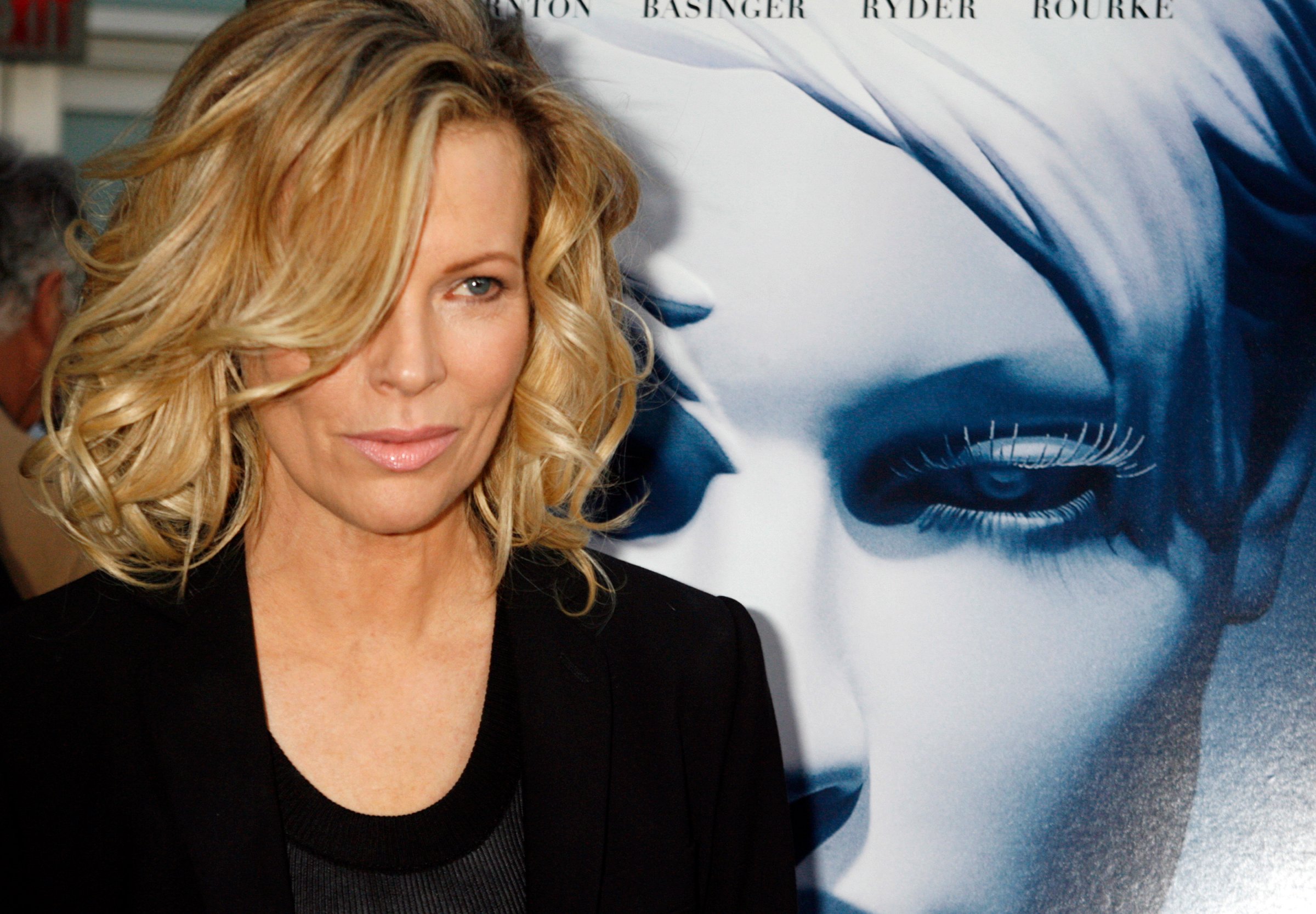 Actress Kim Basinger, star of the film "The Informers", poses at the film's premiere in Hollywood