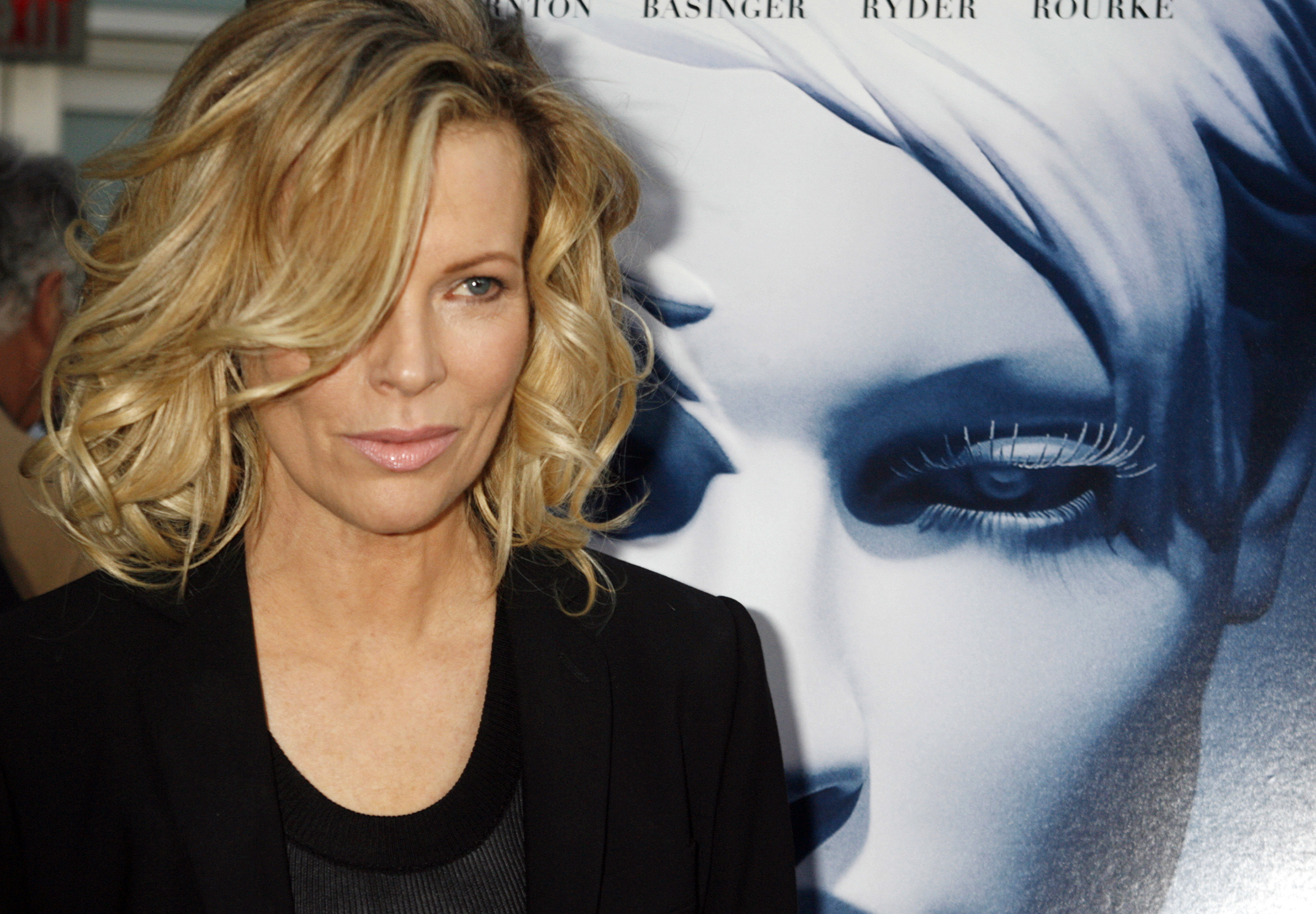 Actress Kim Basinger, star of the film "The Informers", poses at the film's premiere in Hollywood