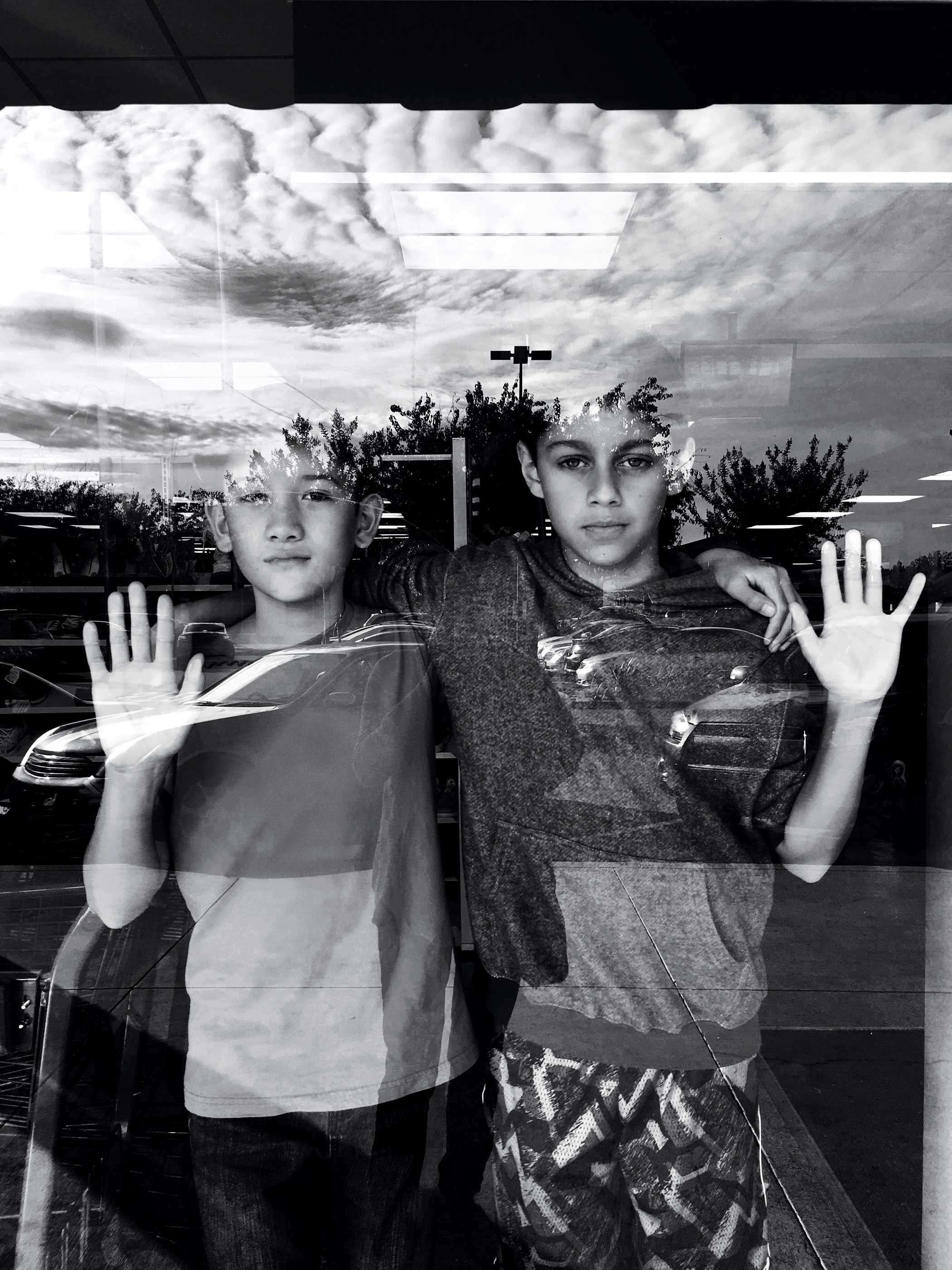 Location: Strip Mall in Castro Valley, CA Subject: son and friend Photograph shot with iPhone 6s, used VSCO