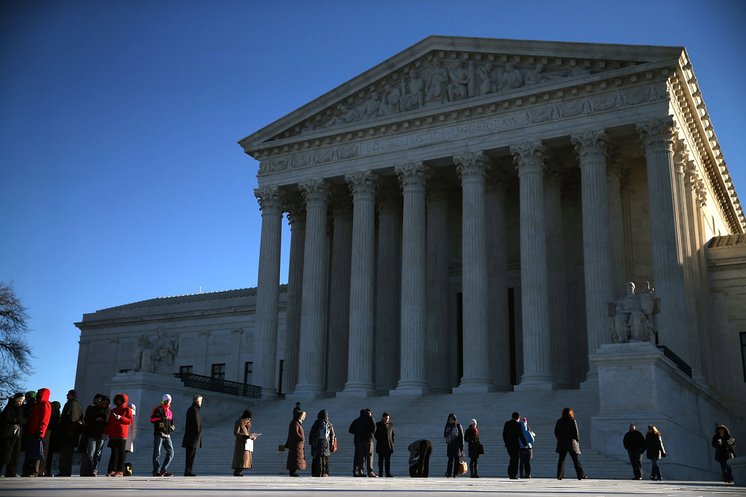 People wait in line to enter the US Supreme Court building in Washington on Jan. 11, 2016. (Mark Wilson—Getty Images)