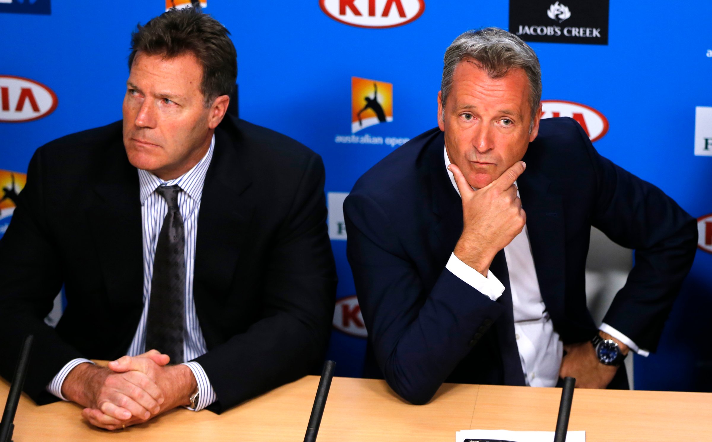 ATP chairman Chris Kermode and vice chairman Mark Young listen to reporter's question during a press conference at the Australian Open tennis championships in Melbourne, Australia on Jan. 18, 2016.